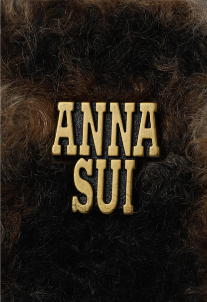 Sunflower Tote with Anna Sui's artist label in golden font on a brown plaid fur print 