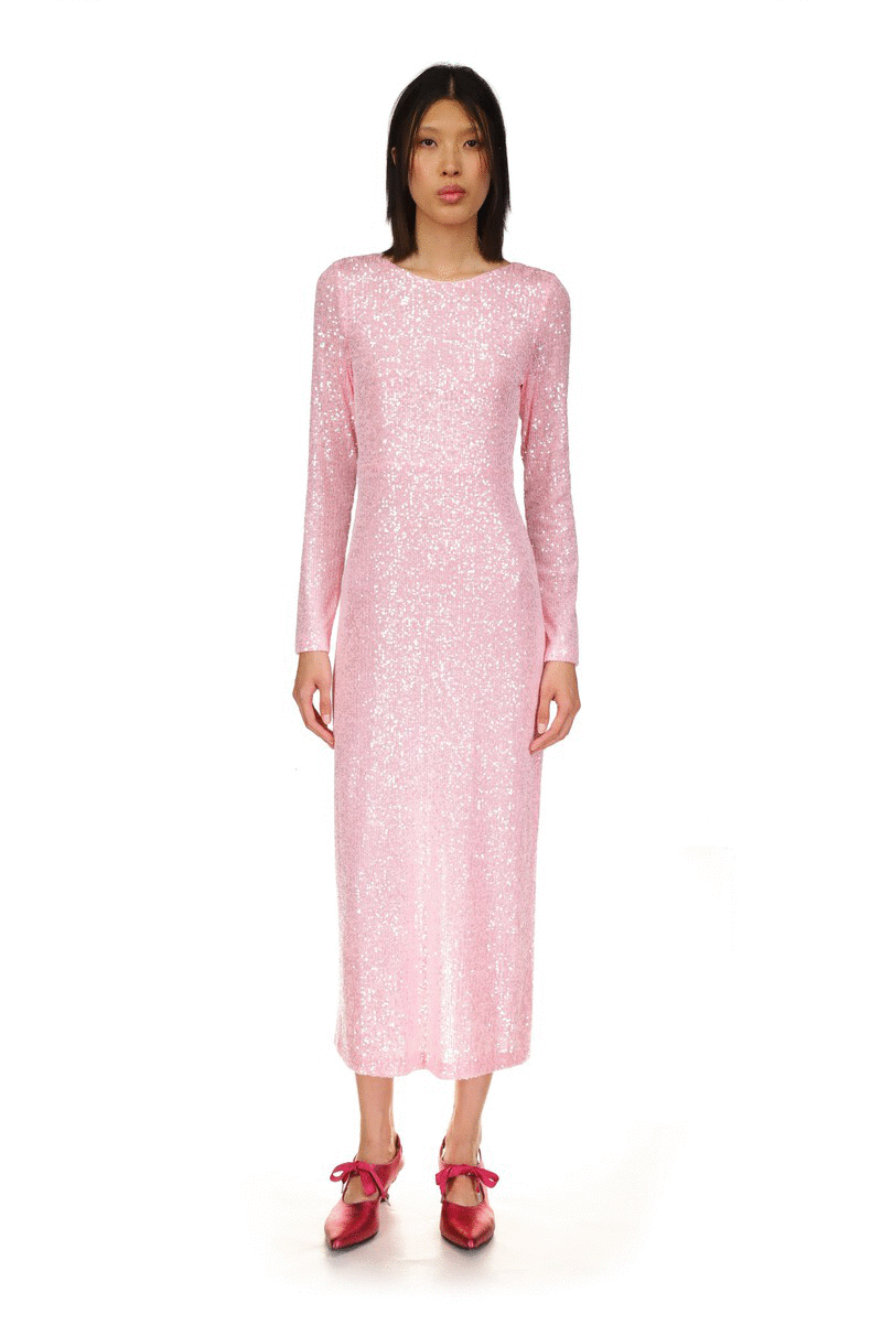 Soft baby pink dress, long sleeves, collar frames the neckline, nude back with two straps to secure it, open bottom to knees