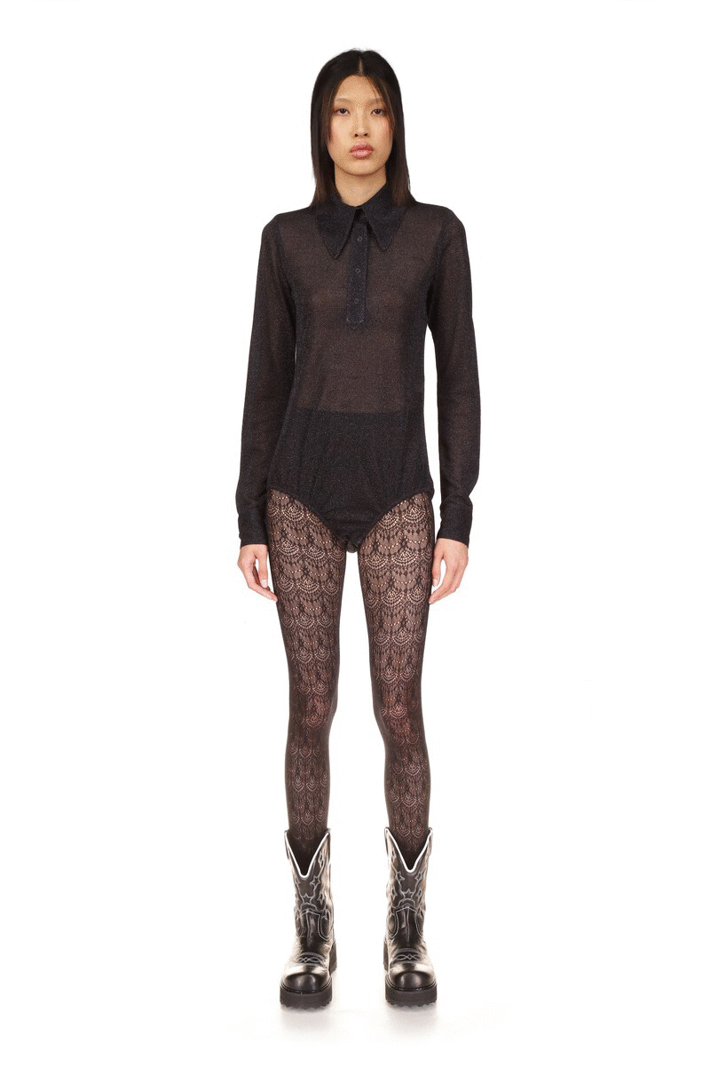 Black see-thru material shoulders to hips, long sleeves, large collar closed by 4 buttons, zipper back