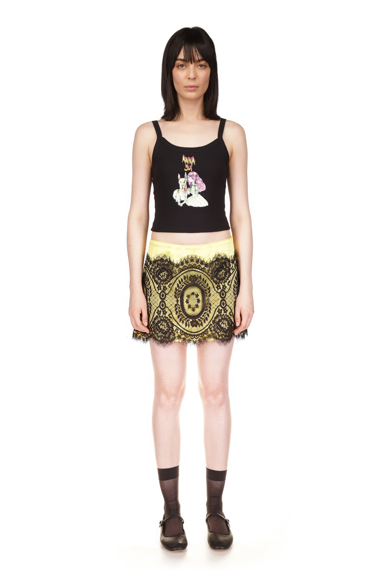 Tank Black, sleeveless, round deep collar front and back, Anna Sui logo above a little girl with a white dog