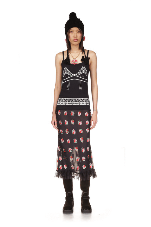The Anna Sui's Rosie Posie Skirt Black is under knee long, with see-through effect from the knee down, black lace at bottom