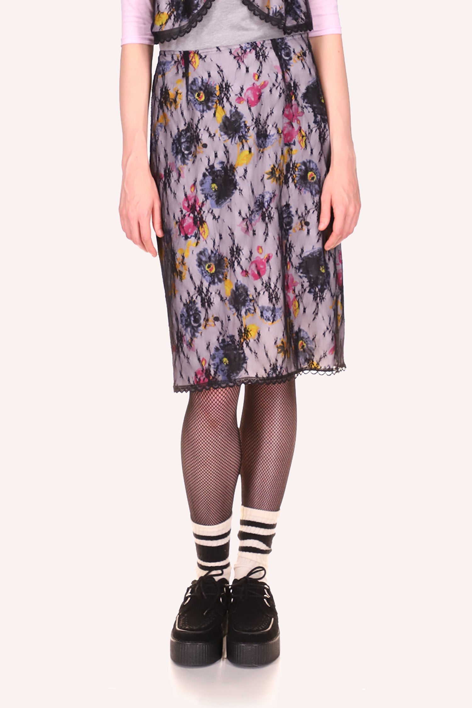 Slip Skirt knee-long, pattern of large lilac, double pink, and yellow colors flowers, bottom hems in black lace