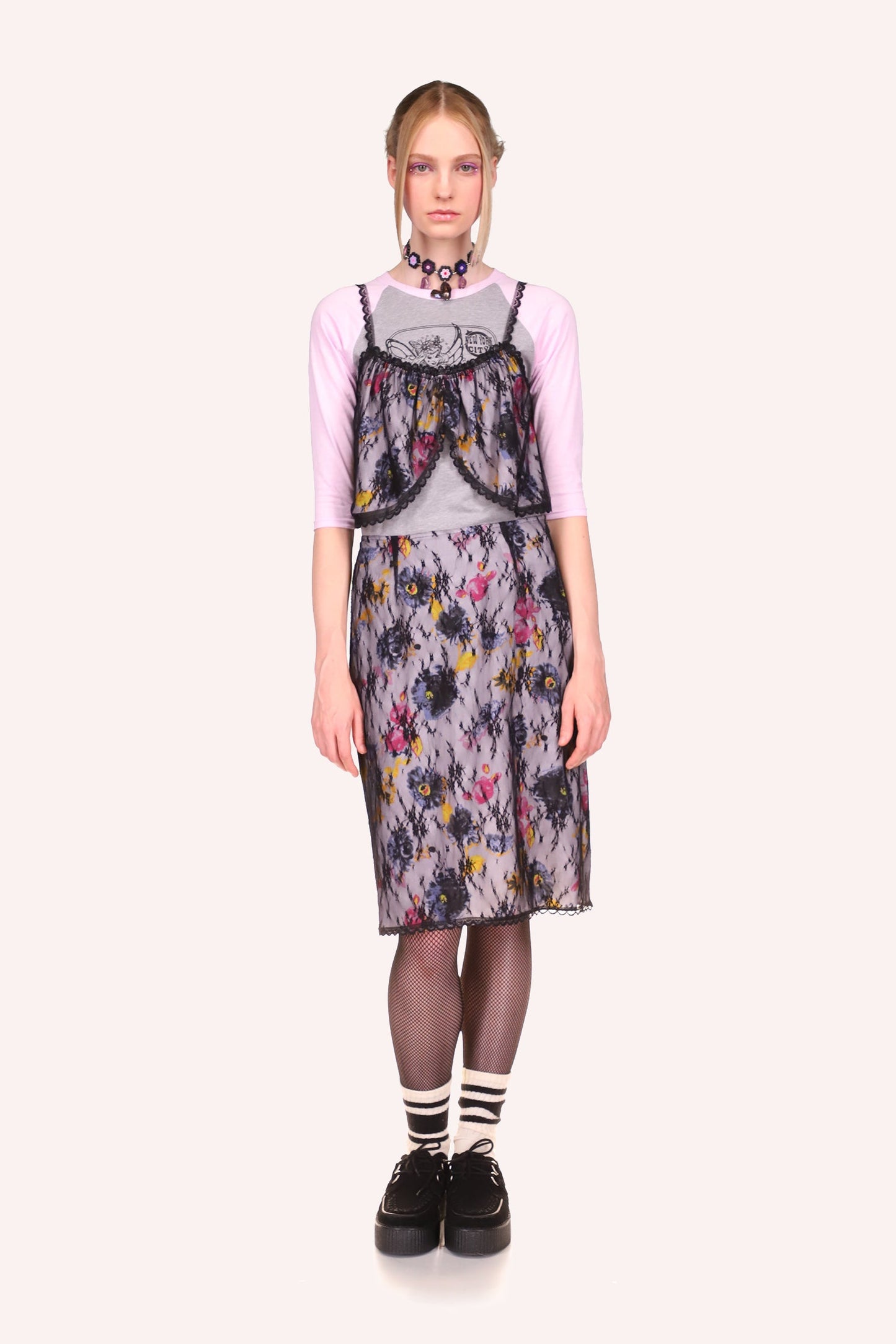 Anna Sui Knee-long skirt, pattern of lilac, pink, and yellow colors flowers, bottom, and side hems in black lace