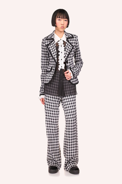 Checkered in B&W, black seams, a wide collar with a V-shaped flap, enhance your curves