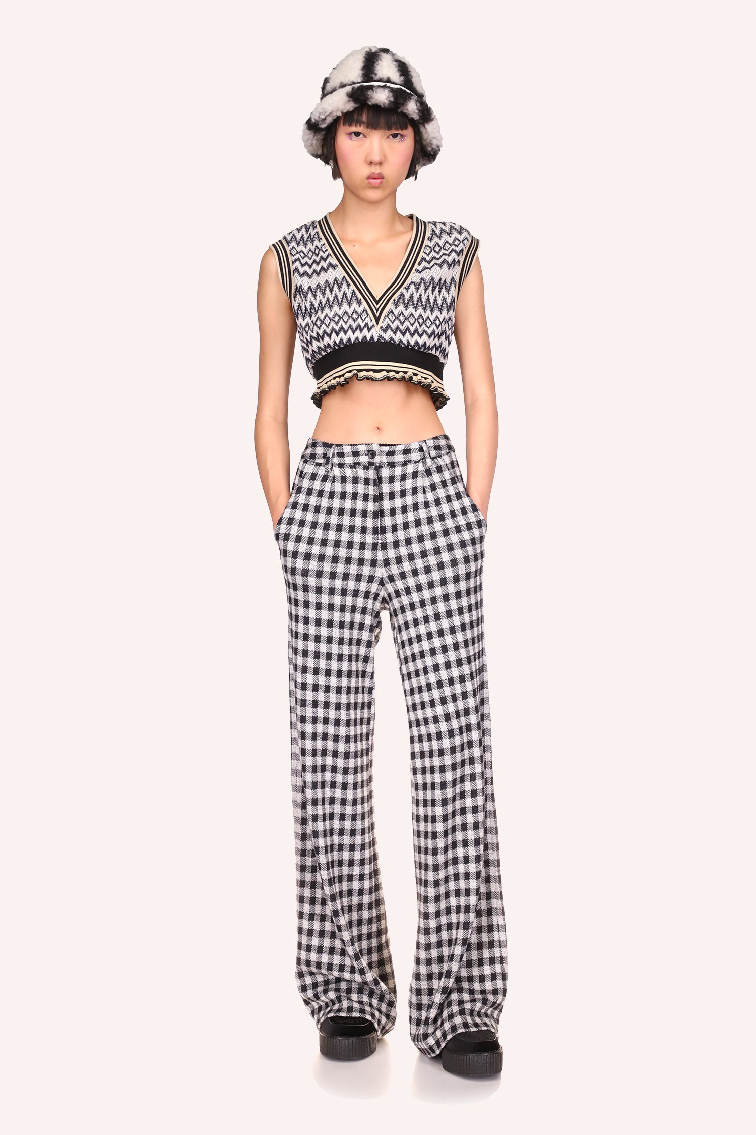 The black Zigzag patterned vest paired with the black Gingham checkered pants accentuate and enhance your curves