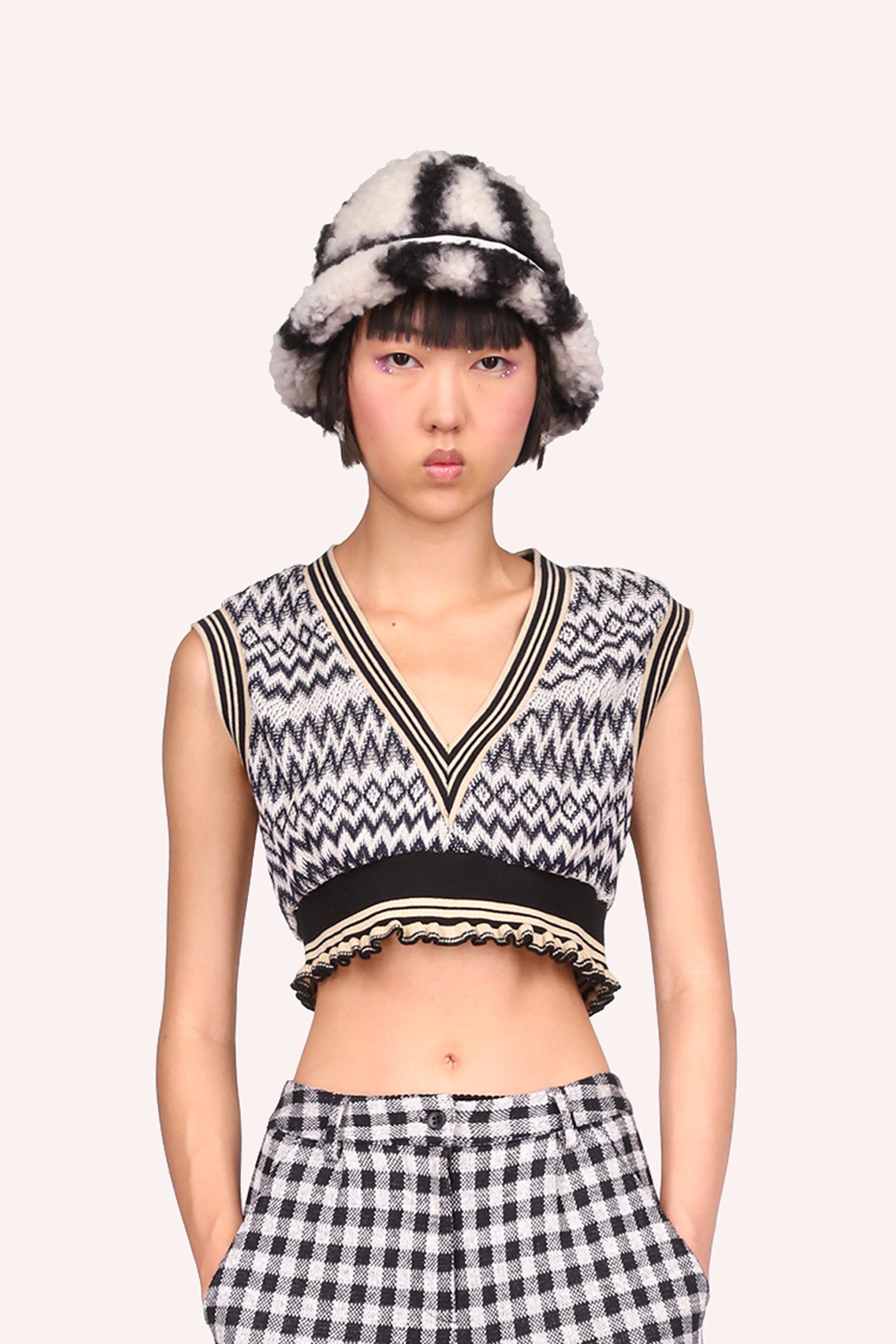 Sleeveless Vest,  under bust long, deep V-Cut collar, pattern of horizontal zigzag lines in black on white background