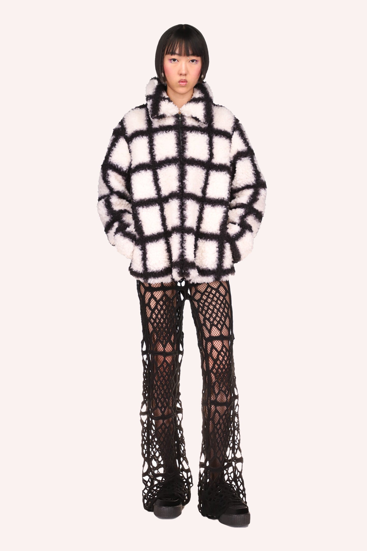 Windowpane Faux Fur Jacket Black is under hips long, a zipper in front and 2-side pockets