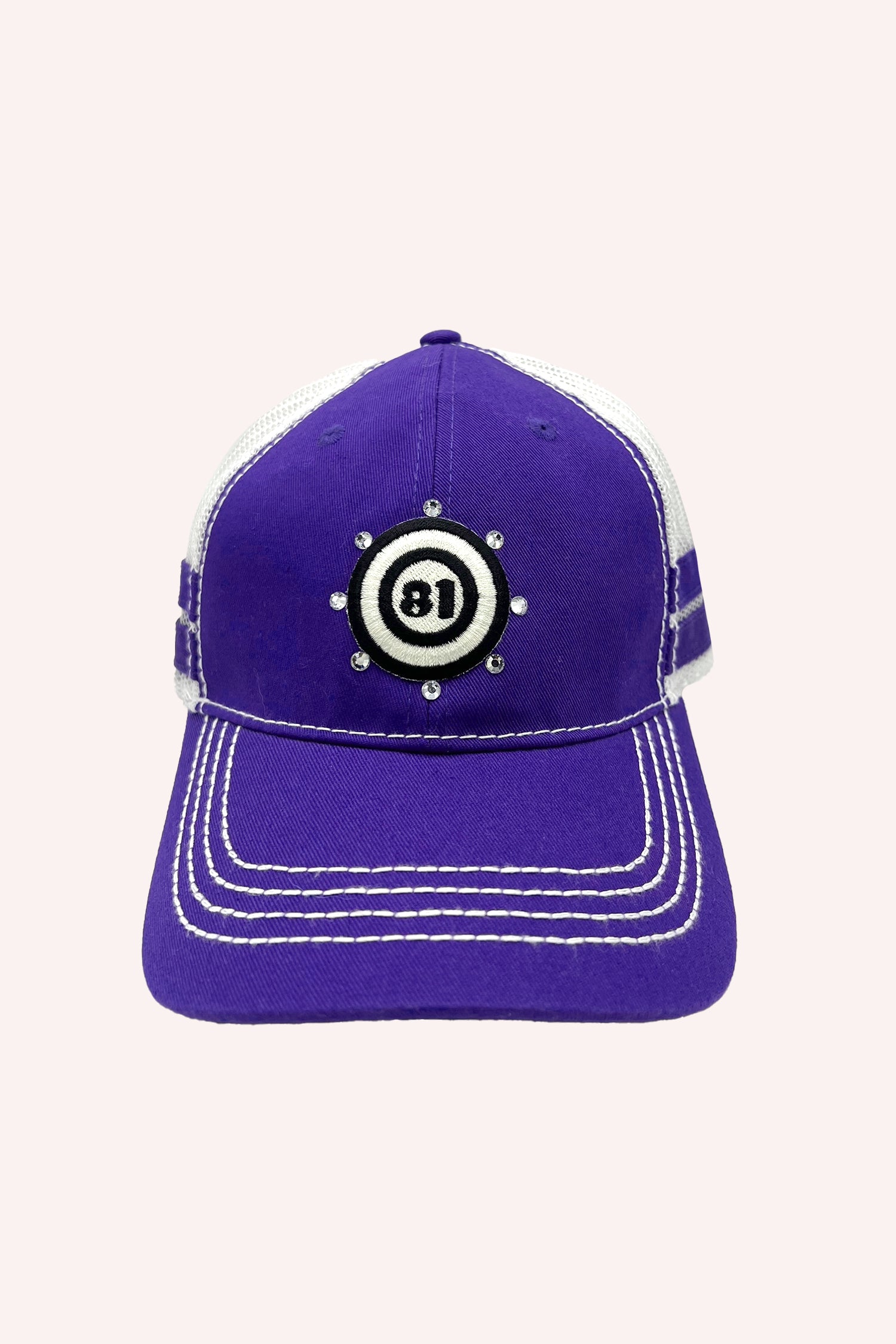 81 Trucker Hat Purple with white stiches, mesh on the back, label in a black and white round target, 8-clear bead around