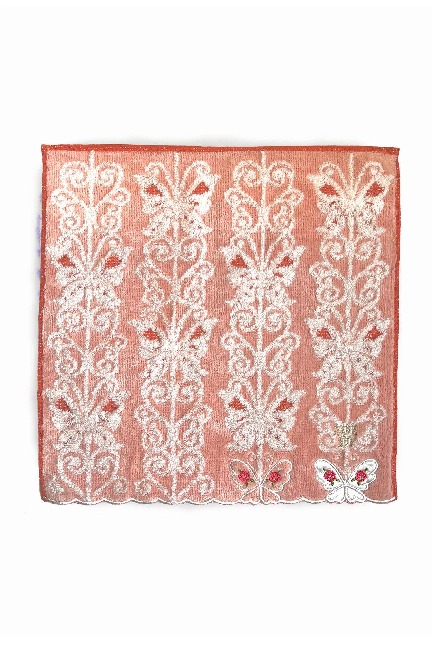 Light Orange Washcloth, white butterfly pattern, small floral details, 2 white butterflies, Anna Sui label 