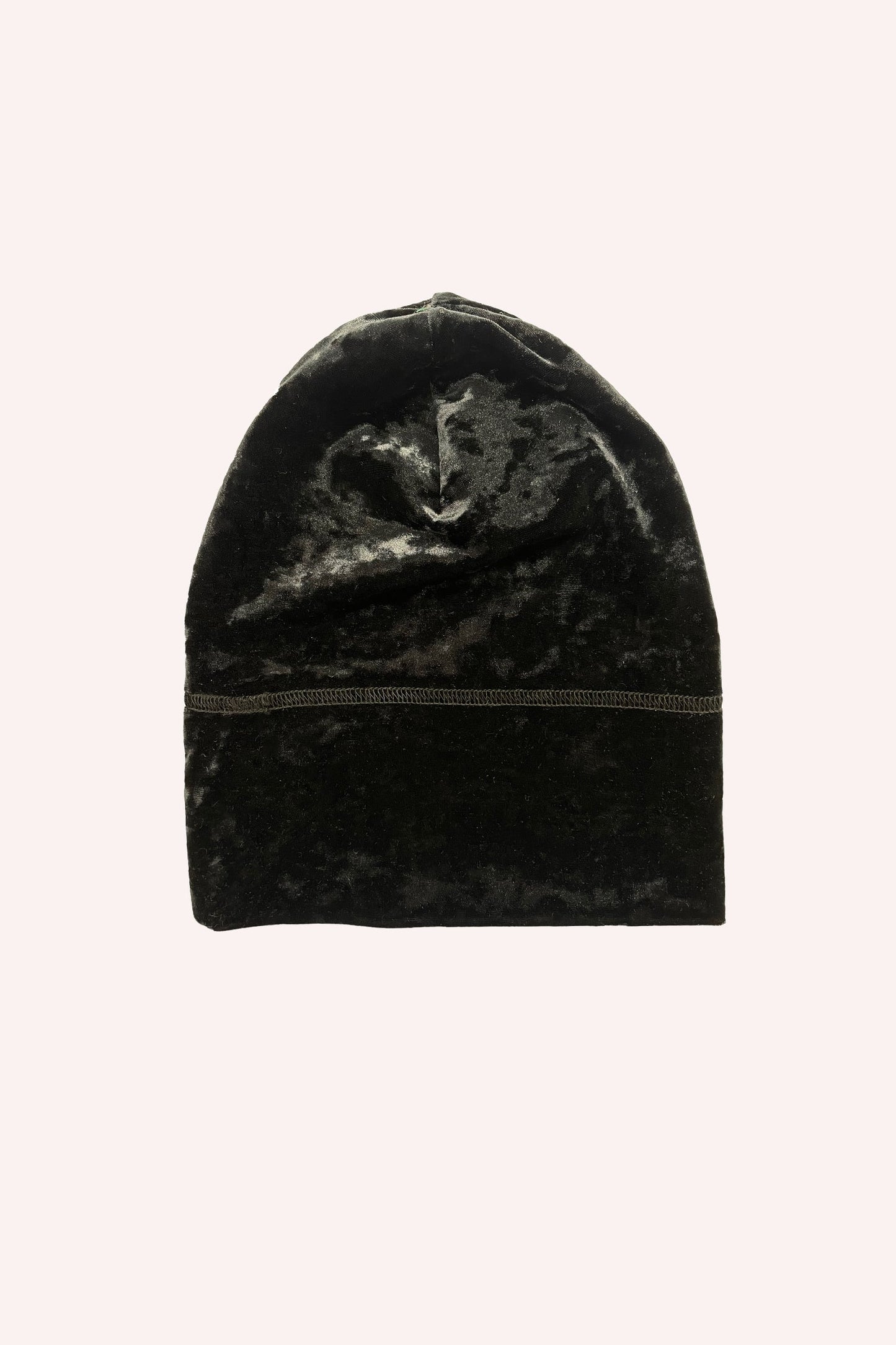 Stretch Velvet Beanie in black, with shiny effects. There are large grey stitches that run around it.