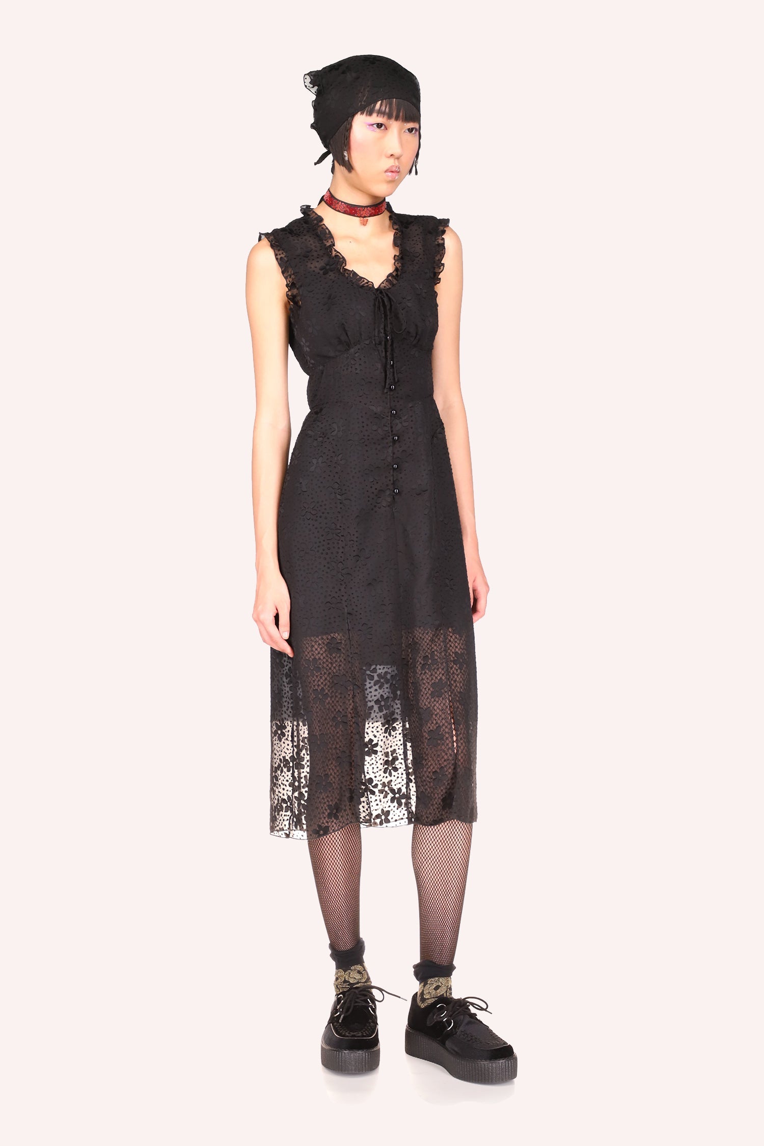 Daisy Dot Burnout Dress Black form-fitting dress with tulle effect on the legs and a small opening on the thighs