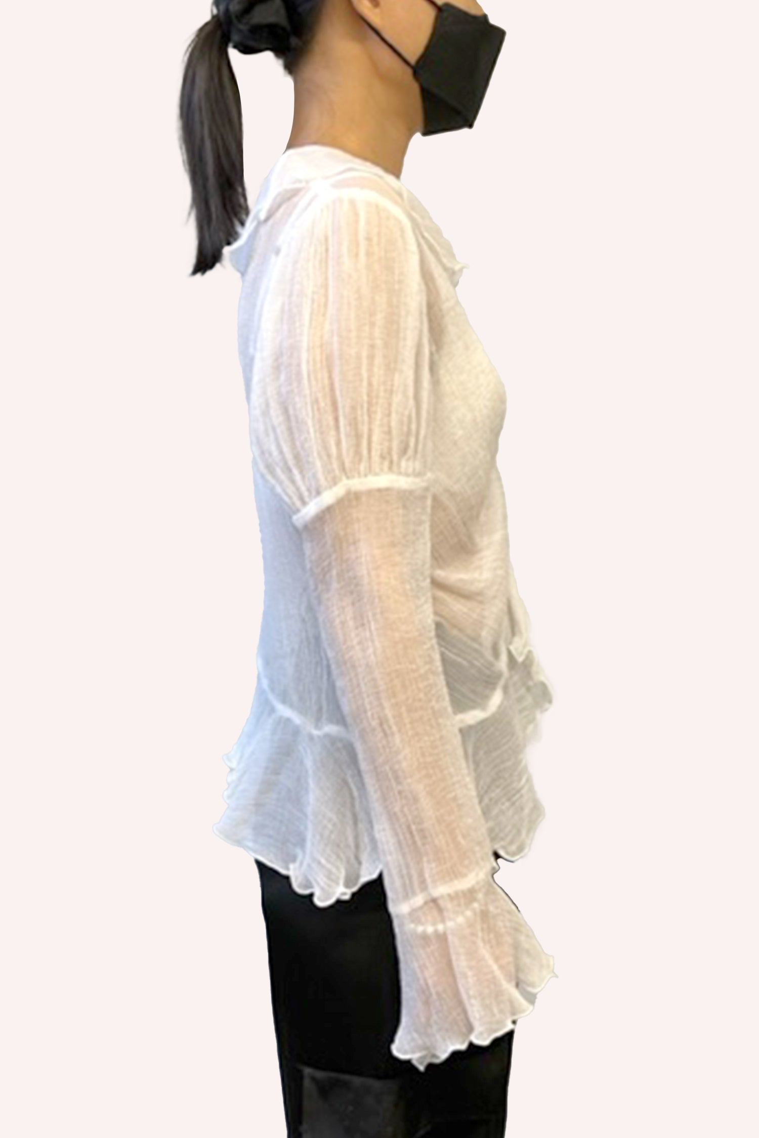 The top of the sleeves with billowy style, bottom of sleeves covers the hands with a ruffle effect