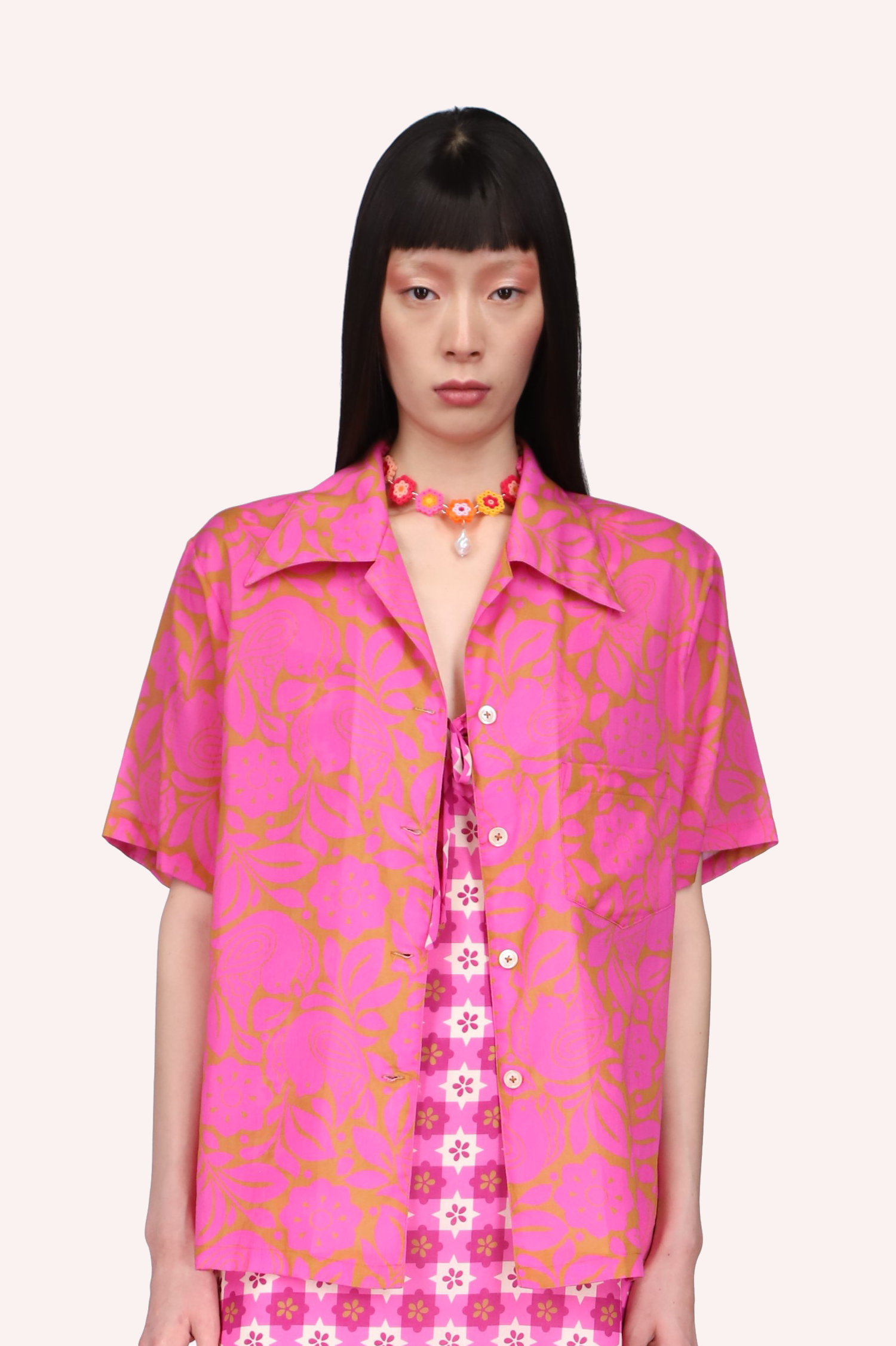 This Bird of Paradise Top Neon Pink with golden design, is elbow long sleeves, 4-nacre buttons, hips long.