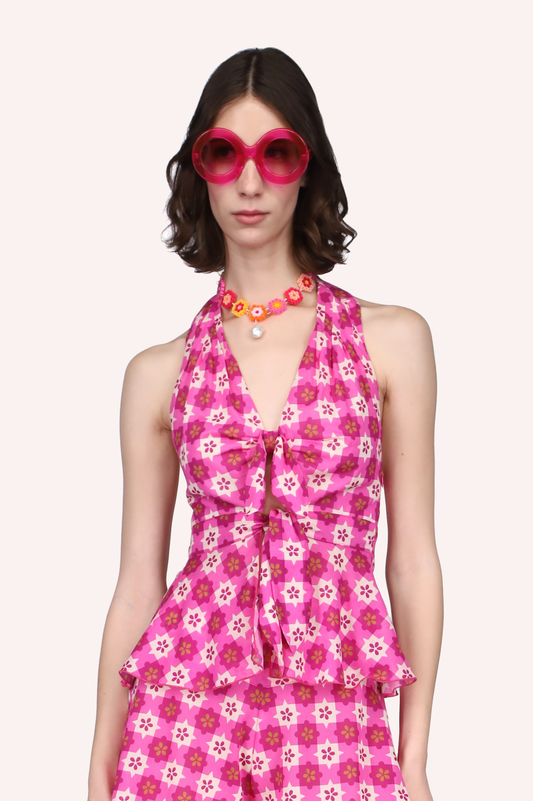 Utopian Gingham Halter Top Pink features a pink and white star-shaped pattern.