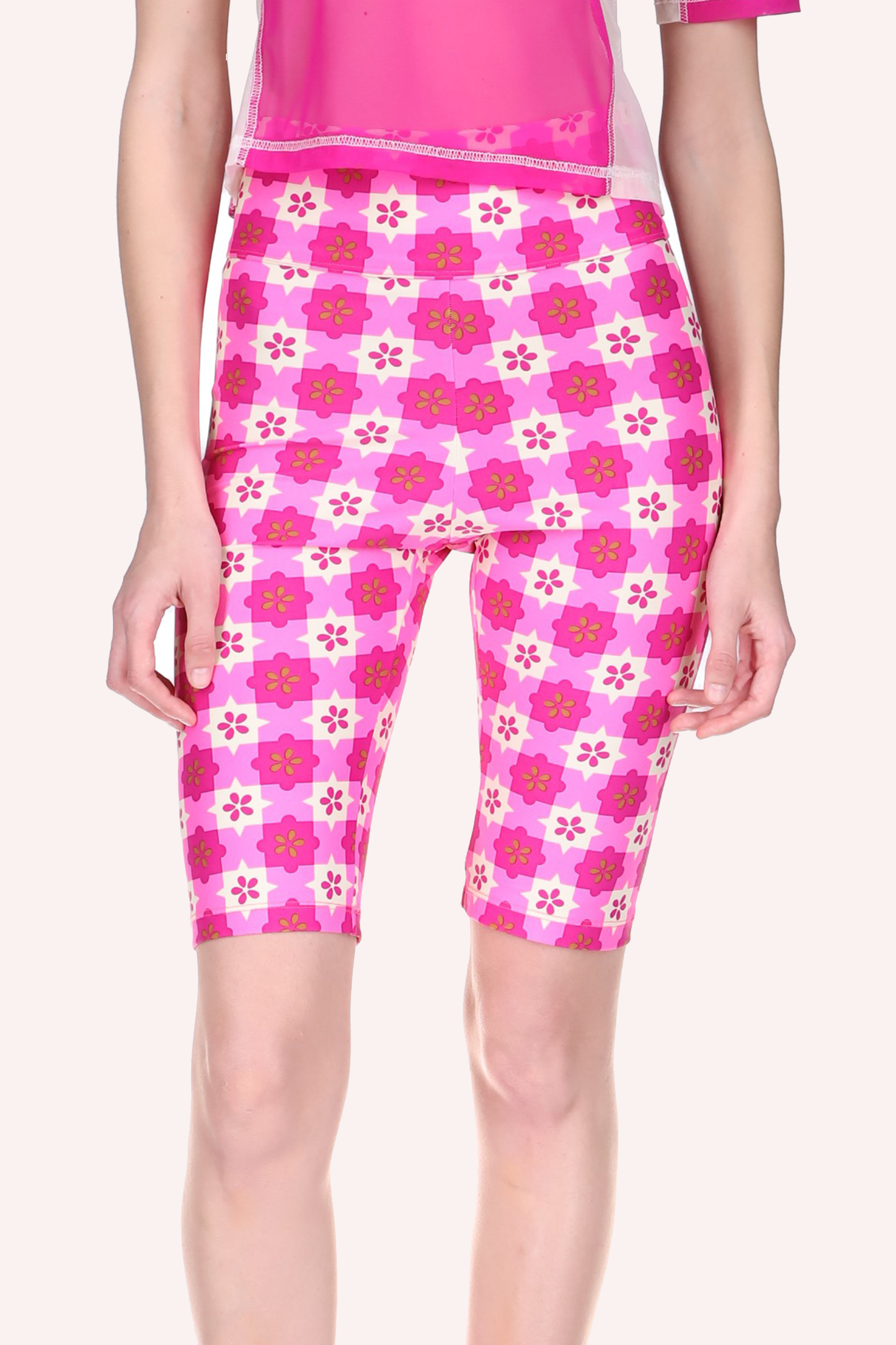 Utopian Gingham Bike Shorts Neon Pink features a pink and white star-shaped pattern