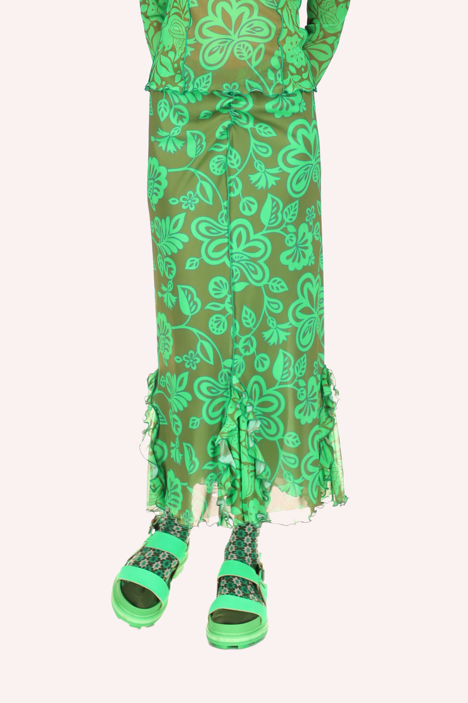 Paradisiac Combo Mesh Skirt Glo Green, with large green flowers on the mesh, the long green stiches in front