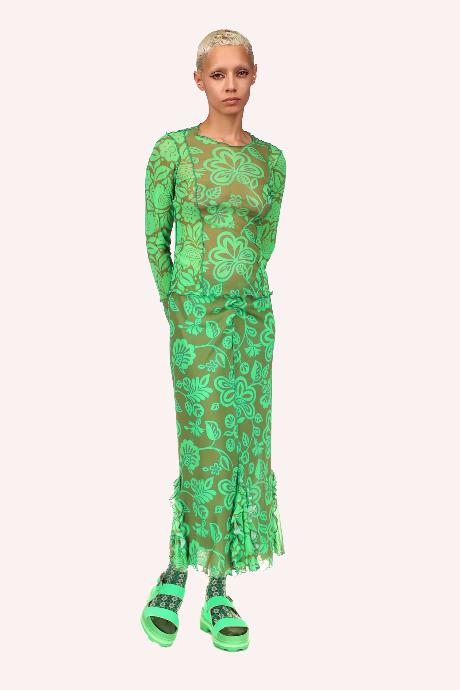 Mesh Skirt Glo Green, with large green flowers on the mesh, the long green stiches in front, green ruffle at bottom