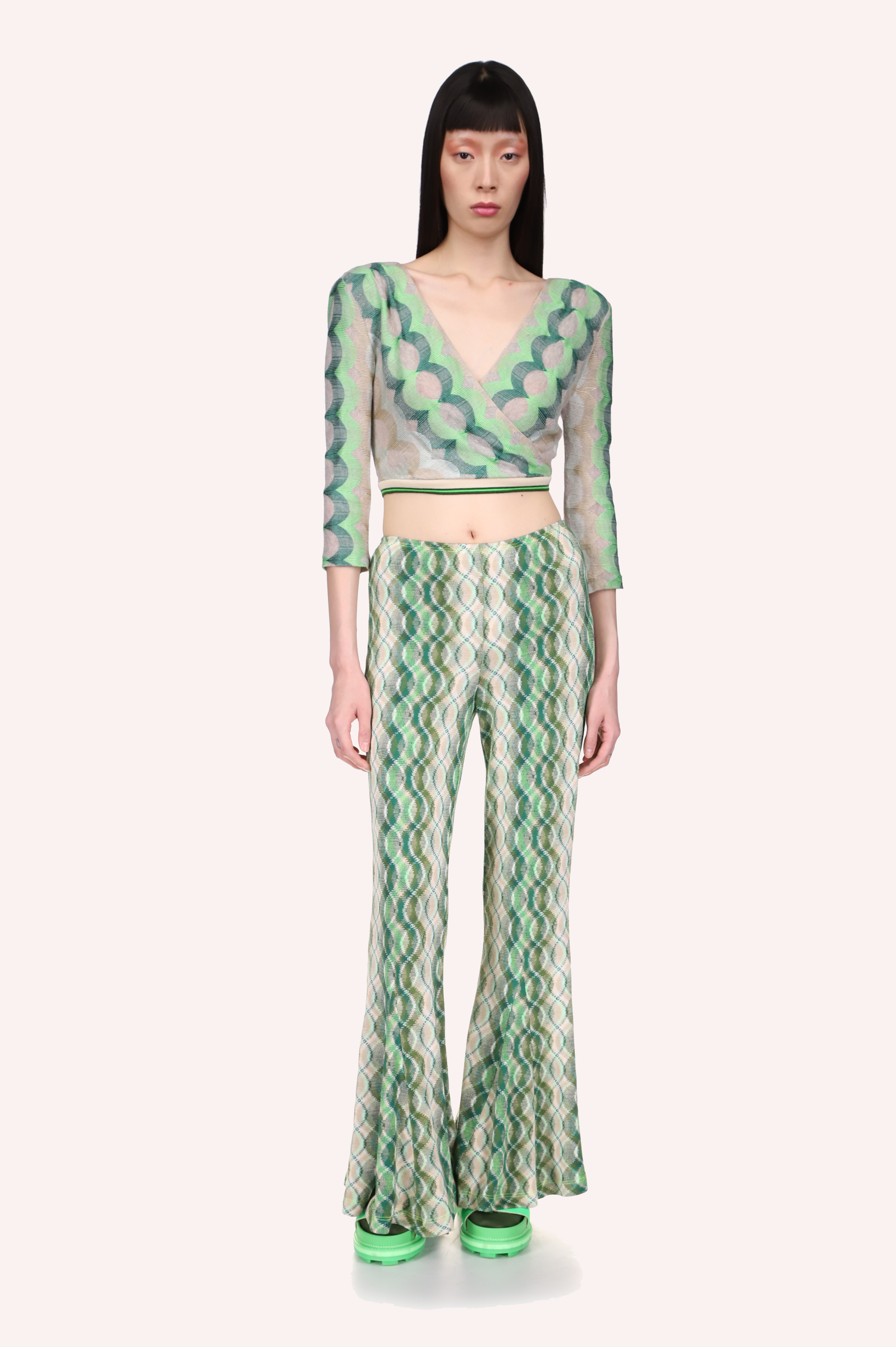 Wave Rider Knit Pant  long fitted pants on the hips, wavy lines in different shades of green, from top to bottom
