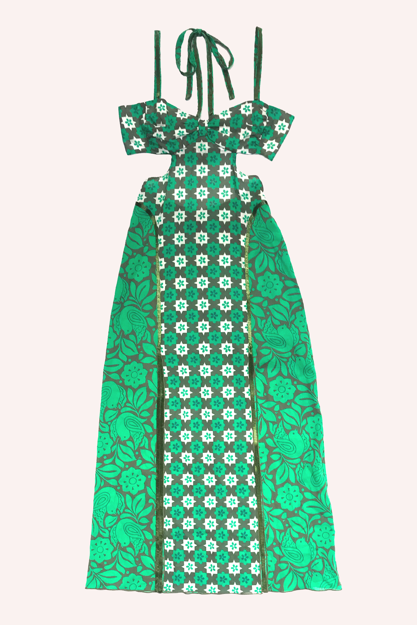 Detail of the floral pattern features a green and white star-shaped pattern, hems in darker green