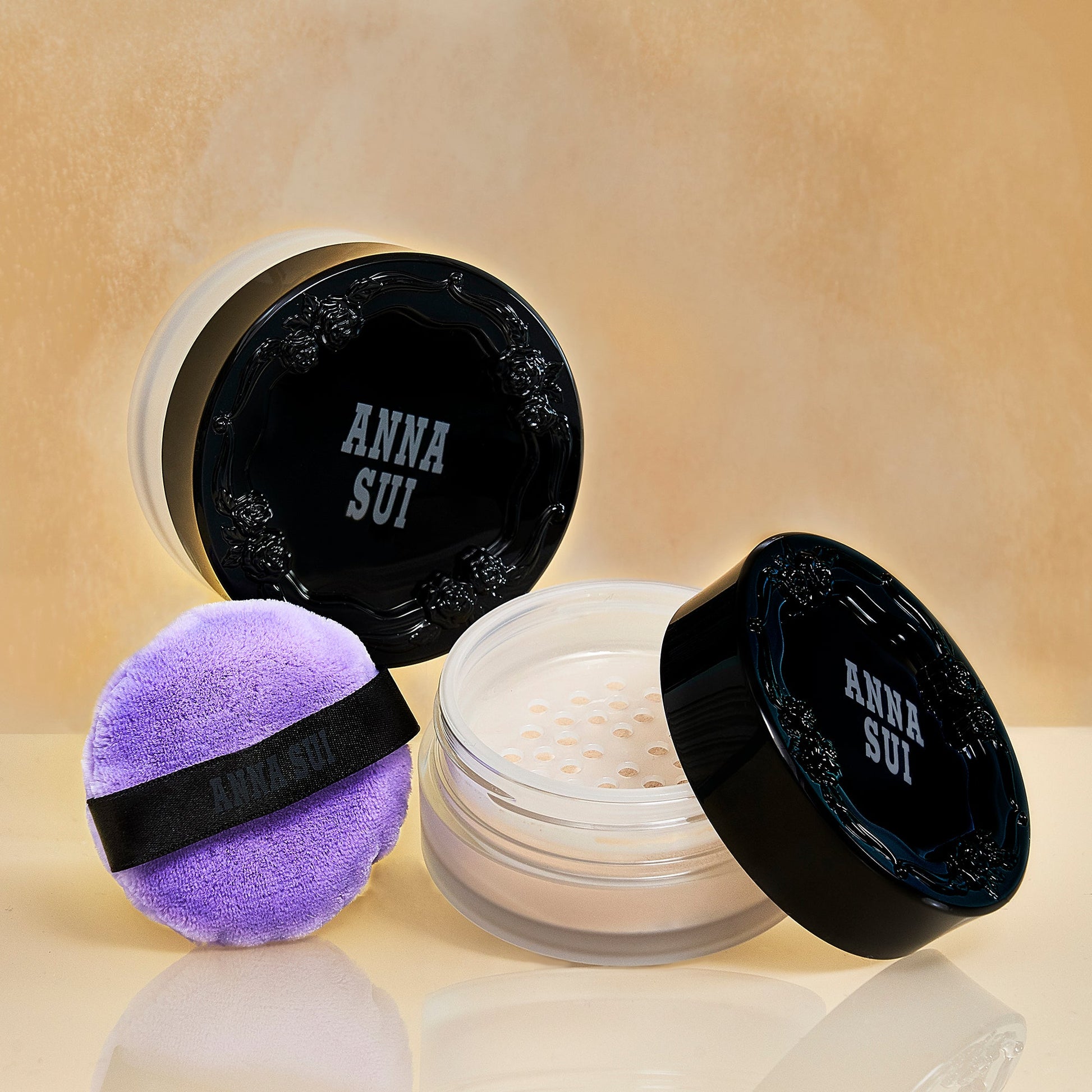 Transparent bottom round case, a purple pad, black lid raised rose pattern, Anna Sui label top lid