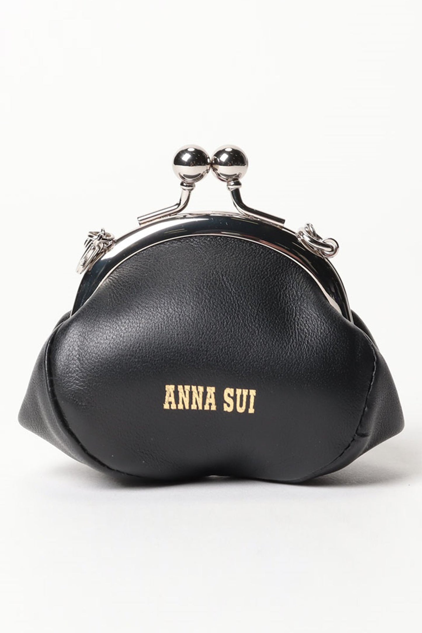 On the black side of the Candy Charm Mini Purse Black, Anna Sui logo in golden fonts