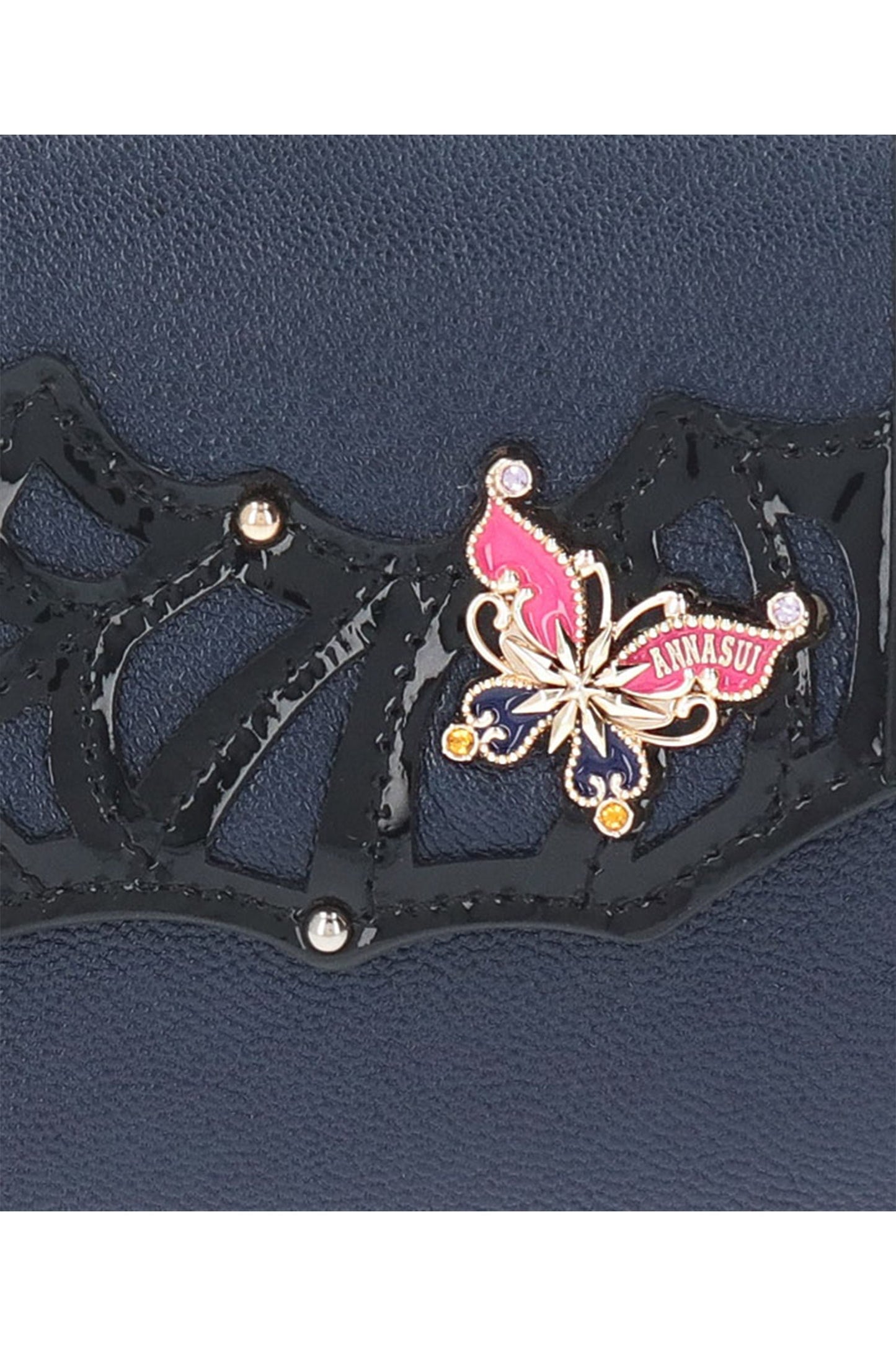 Golden butterfly, pink wings up, Anna Sui label, blue down, center with star, gemstones