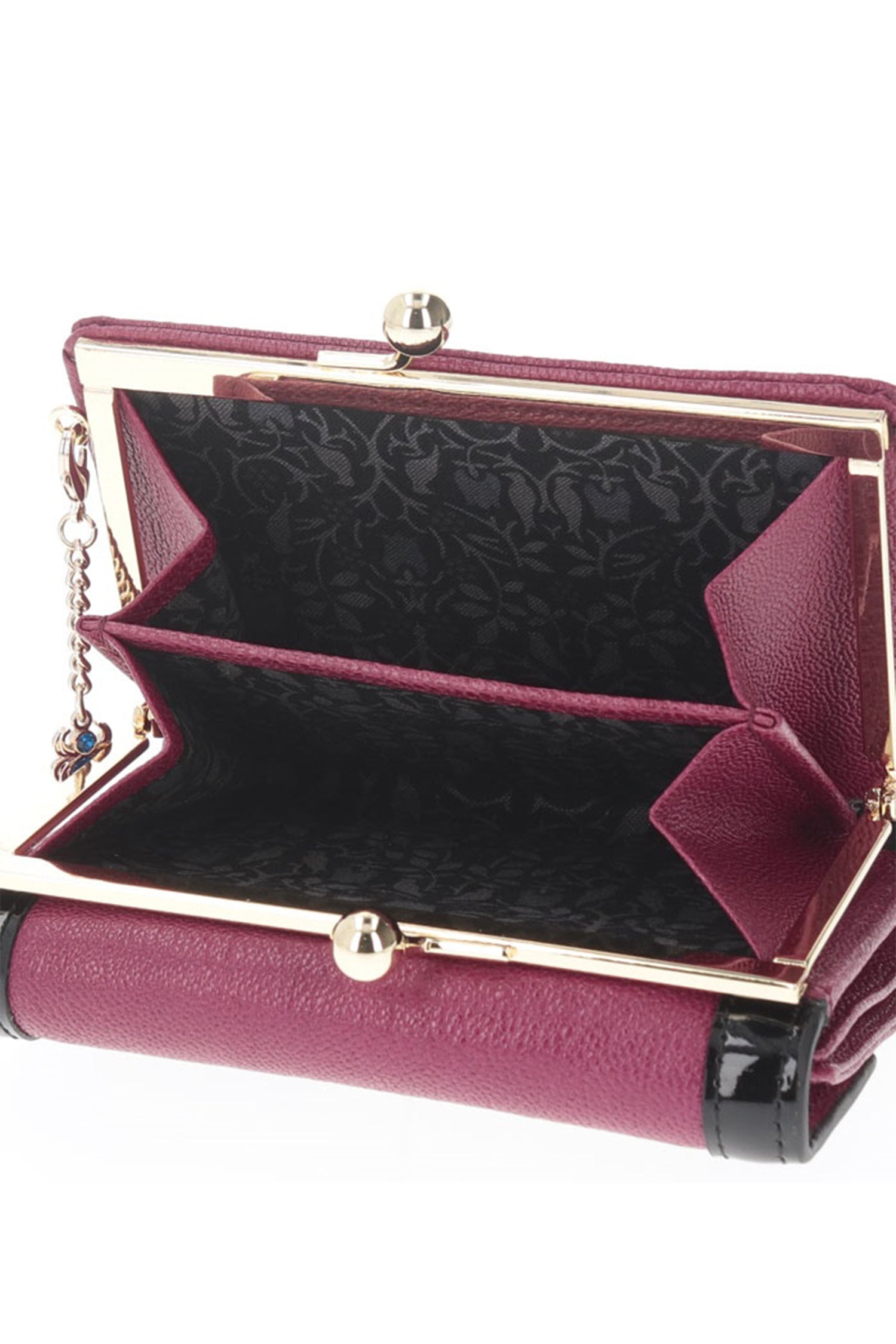 When open, the Poison Clasp Bi-fold Wallet Bordeaux shows two space to have your change in it