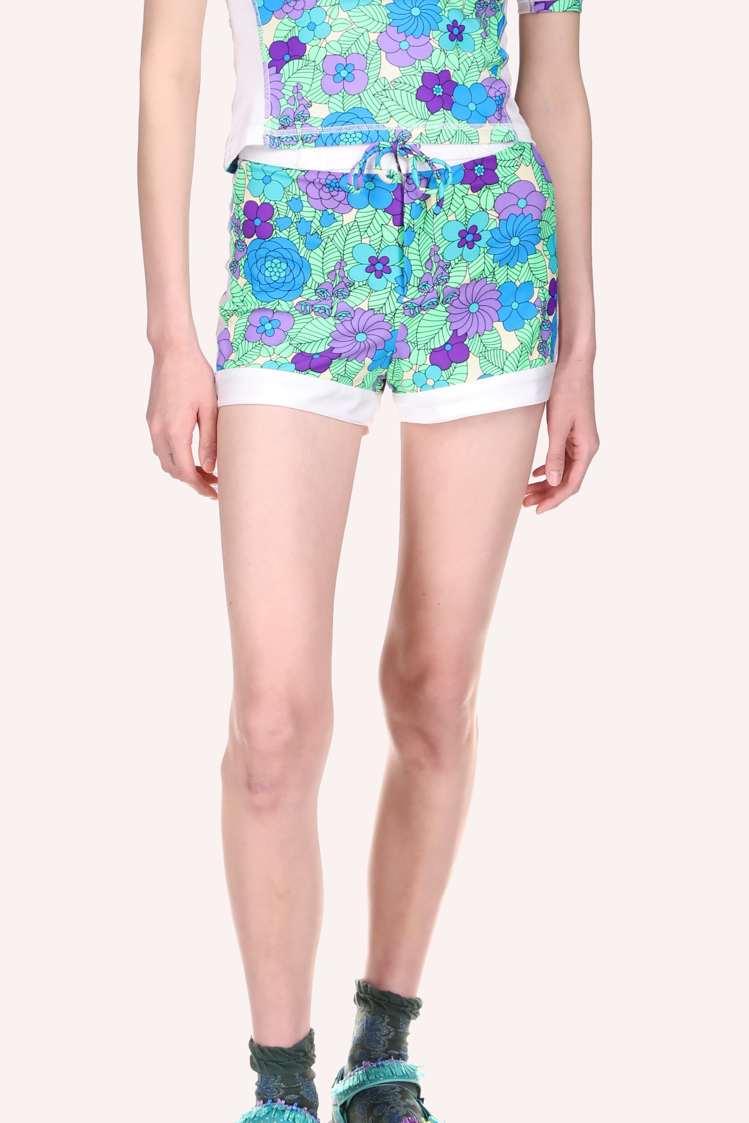 Beckoning Blossoms Surf Shorts, mid tight long, floral design in blue, a white band at bottom hem