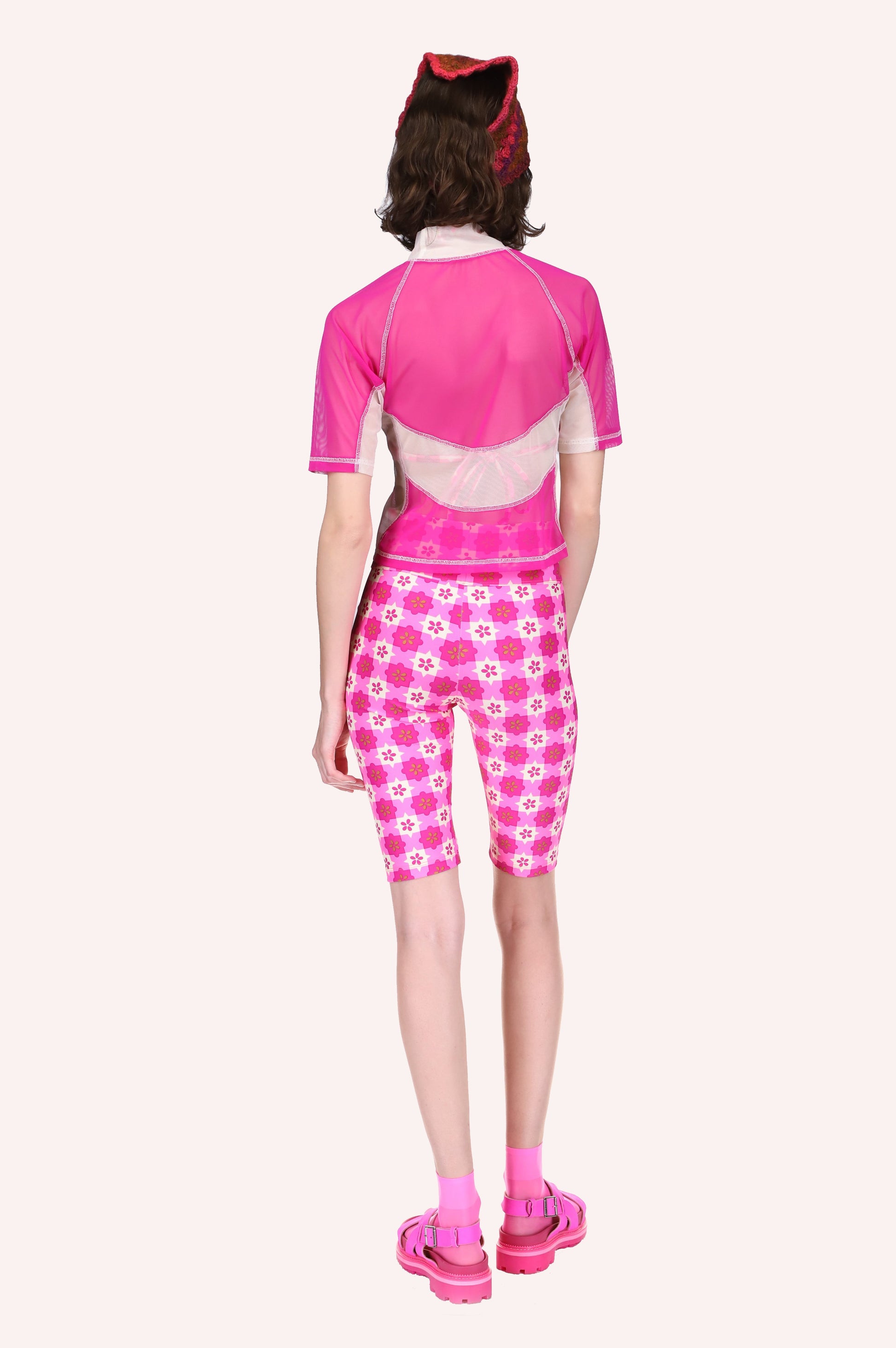 Gingham Bike Shorts Neon Pink features a pink light and dark and white star-shaped pattern