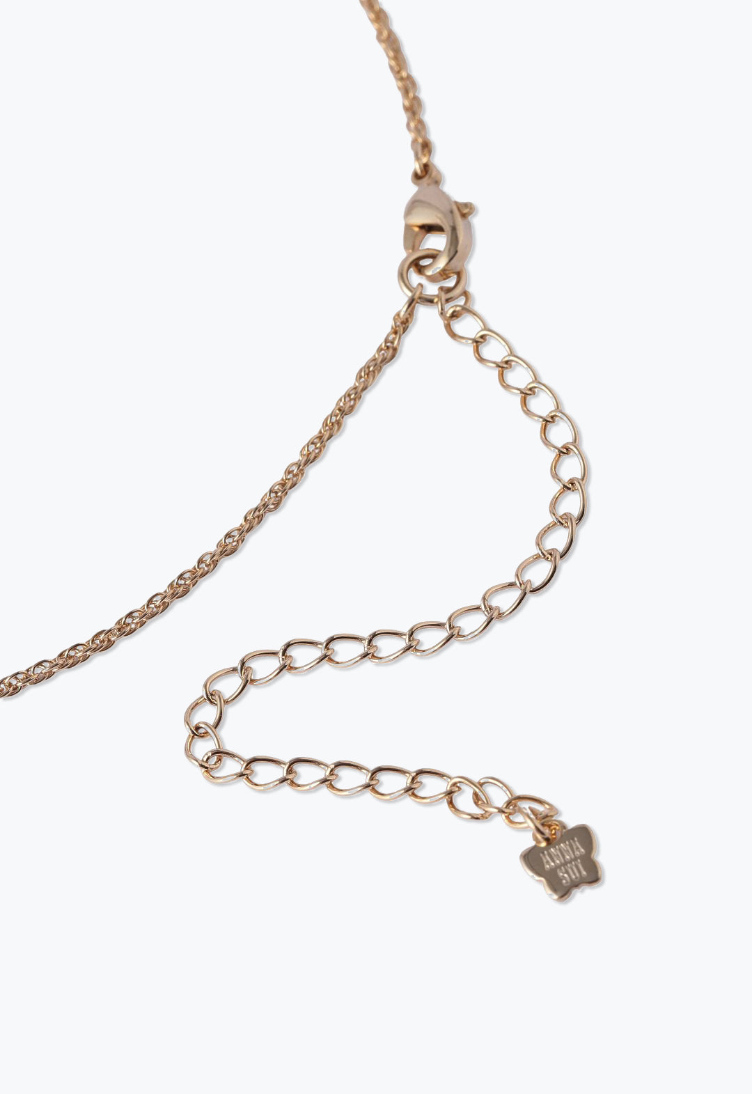 Gold color chain, a lobster claw clasp with large links for adjustability, Anna Sui imprint on a tag