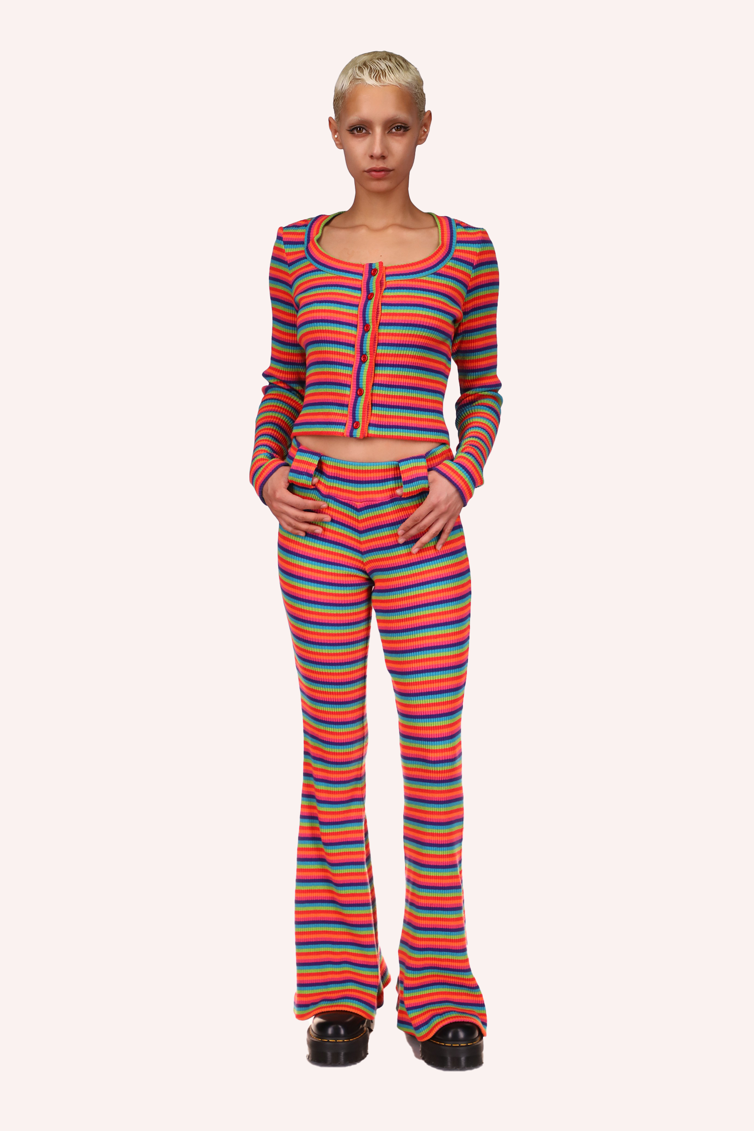 The rainbow-striped pants are a perfect choice to pair with the rainbow-striped sweater.