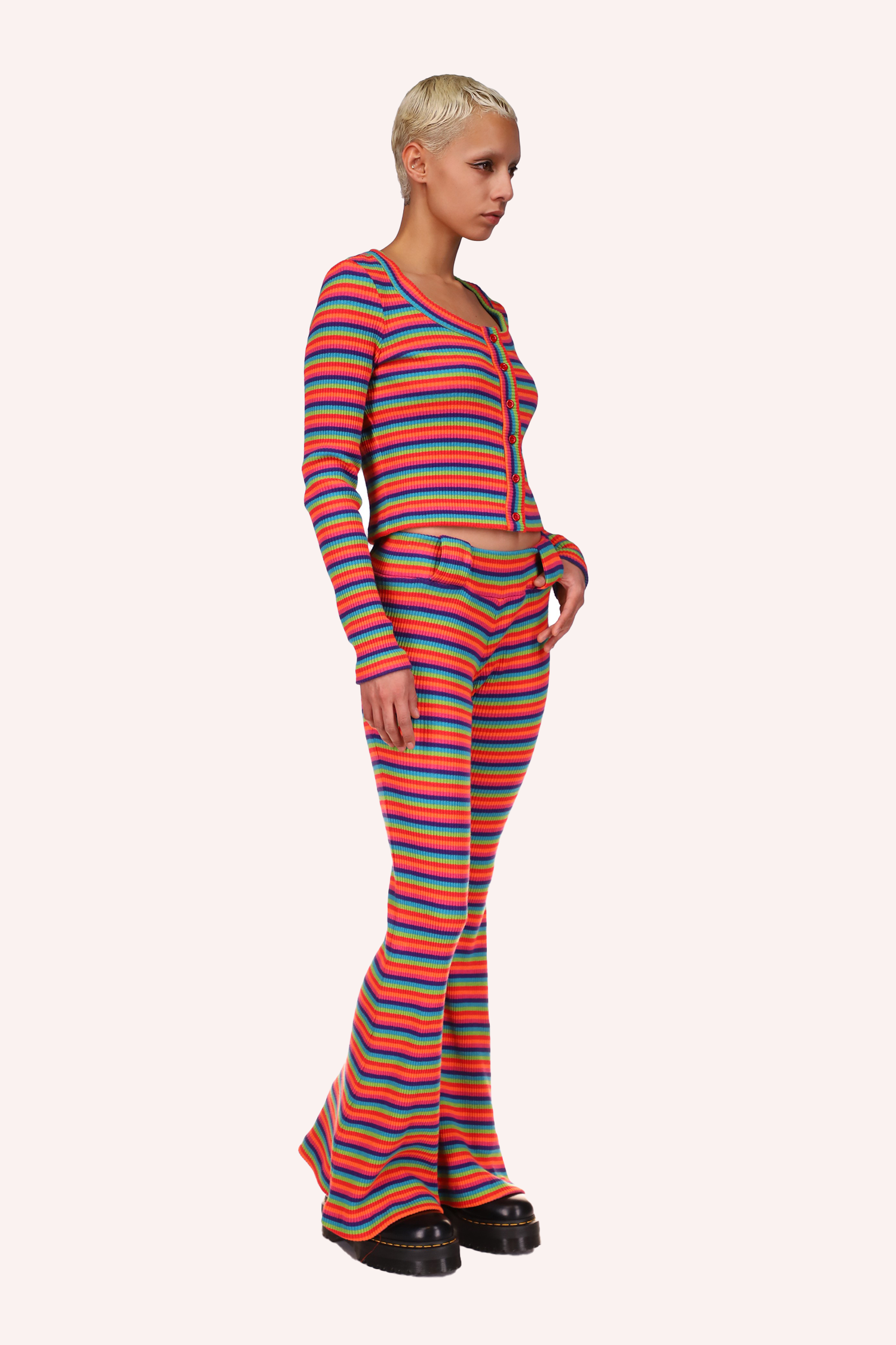 Rainbow Stripe Sweater goes to the hips and stops at the belly button, the sleeves are long and cover the wrists
