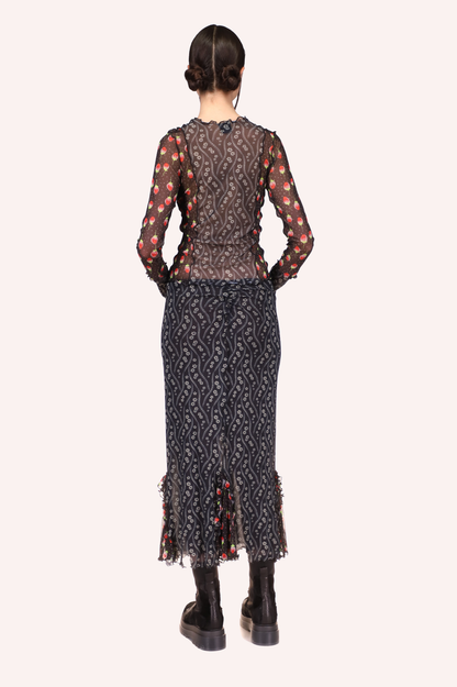 Fitted skirt above ankles long. Transparent ruffles at bottom 