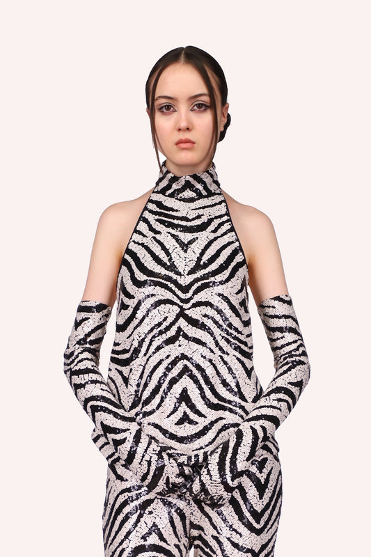 Top sleeveless, front goes up to a turtleneck, the design is in black and white as a zebra pattern