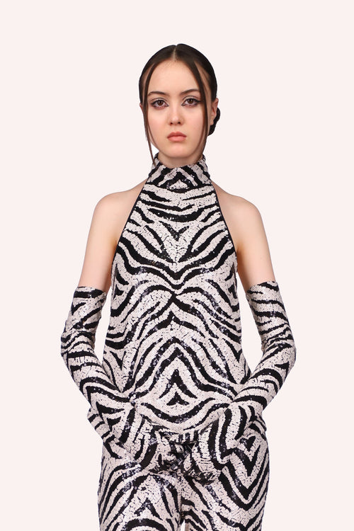 Zebra Sequin Halter Top sleeveless, front goes up to a turtleneck, the design is in black and white as a zebra pattern