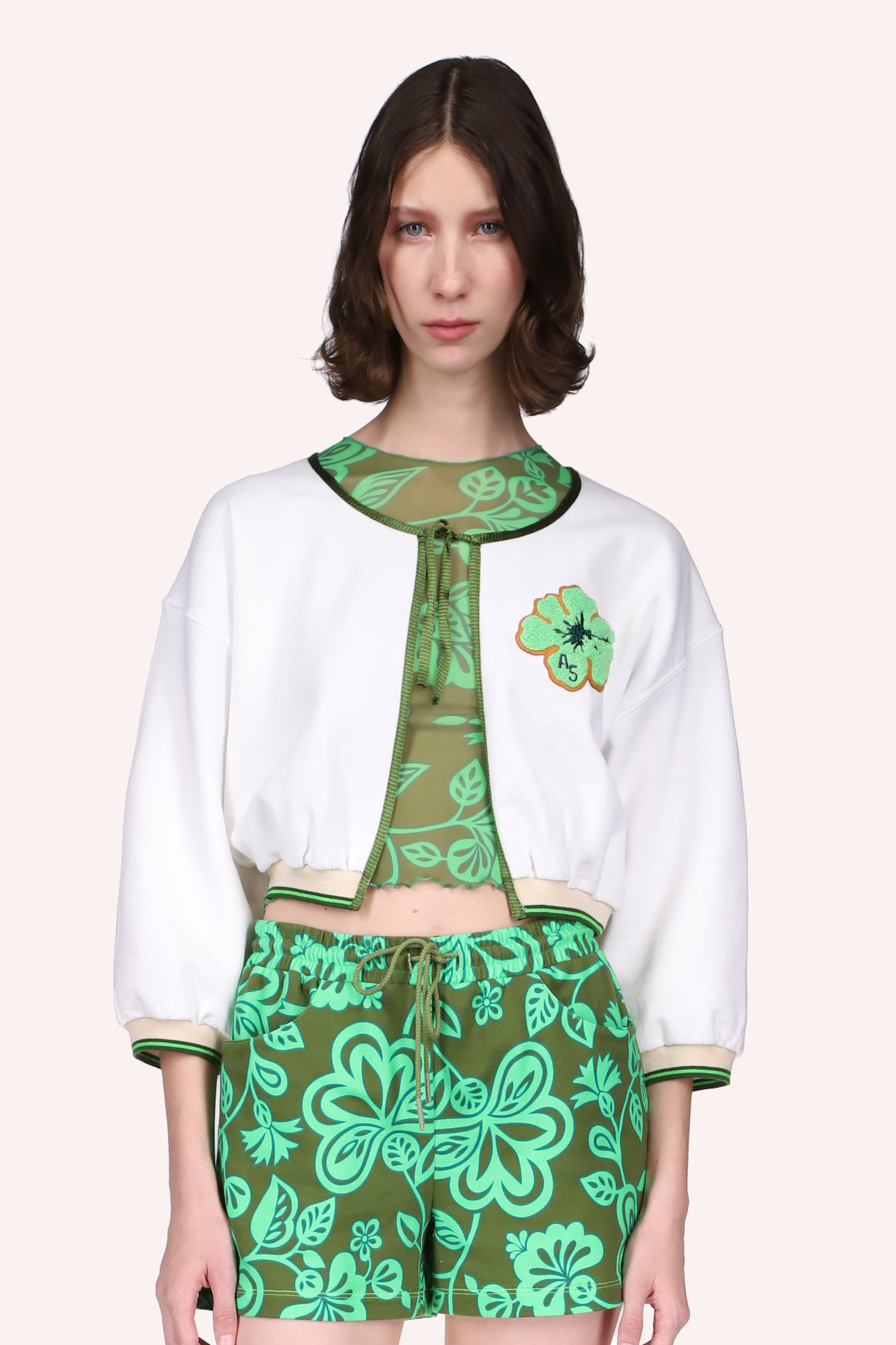 Tropical Havana Cardigan white, with green seams, ribbon knot to tied, round collar, large green flower on left