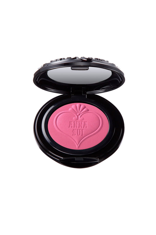 Powder Blush in round black container, mirror in the top lid, heart-shaped & A. S. label on powder