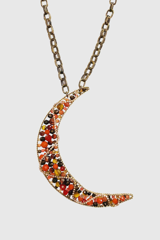 Necklace, a croissant noon with colored gems and zigzag golden chain, overall color is orange