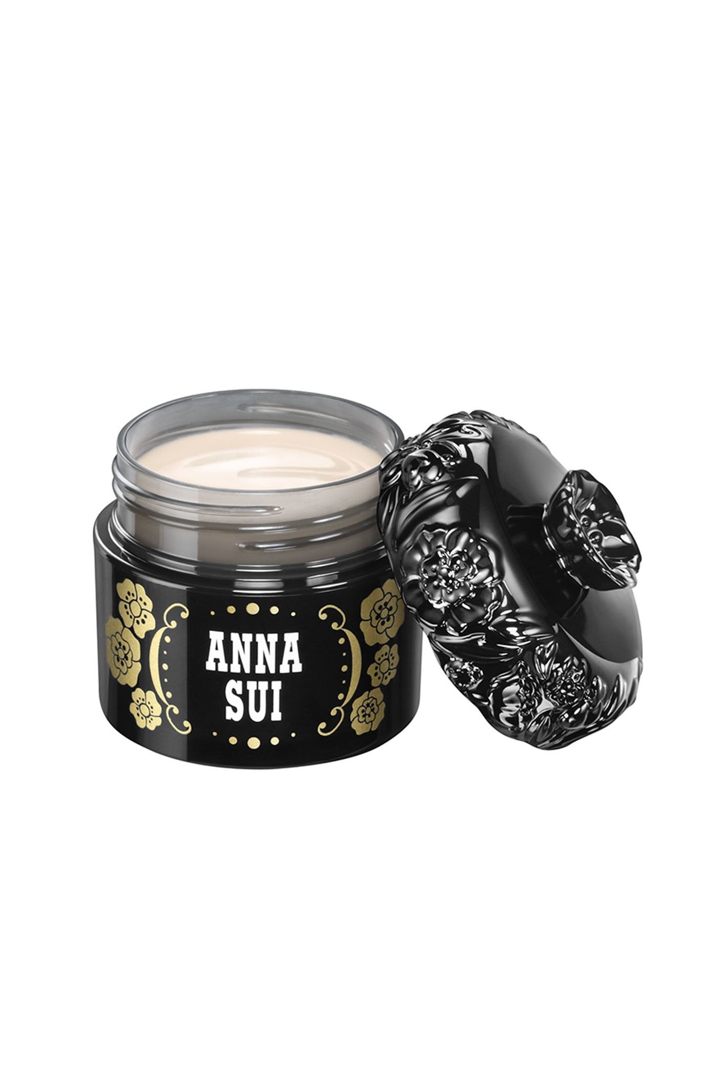 A black round case with a floral design and Anna Sui, the lid, black with raised rose pattern around, and a rose at the top