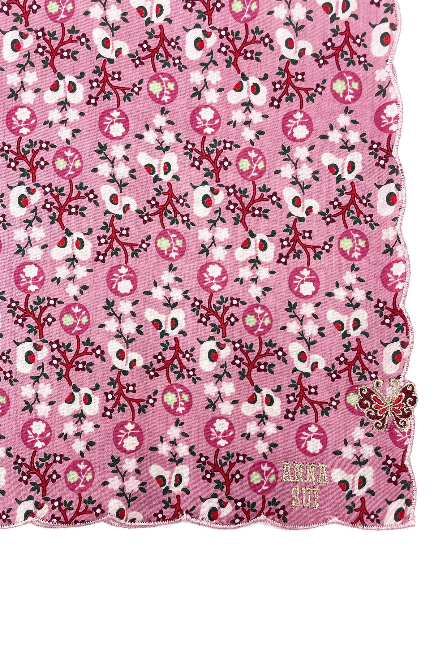 Handkerchief pink detail of repetitive pattern of white butterflies, and pink/white floral, Anna’s label