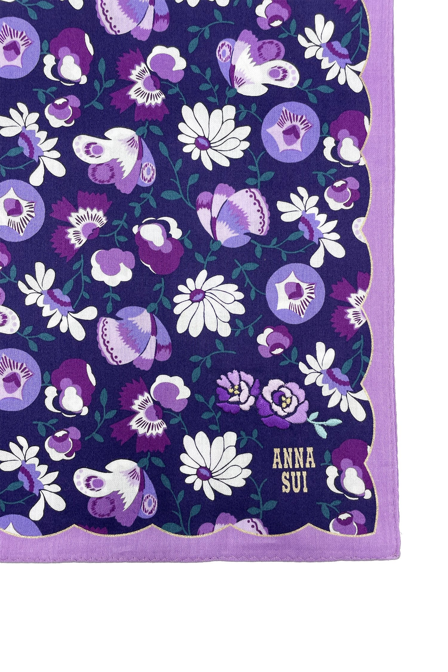 Handkerchief with white/purple daisy on dark blue, wavy purple hems, golden Anna’s label in corner