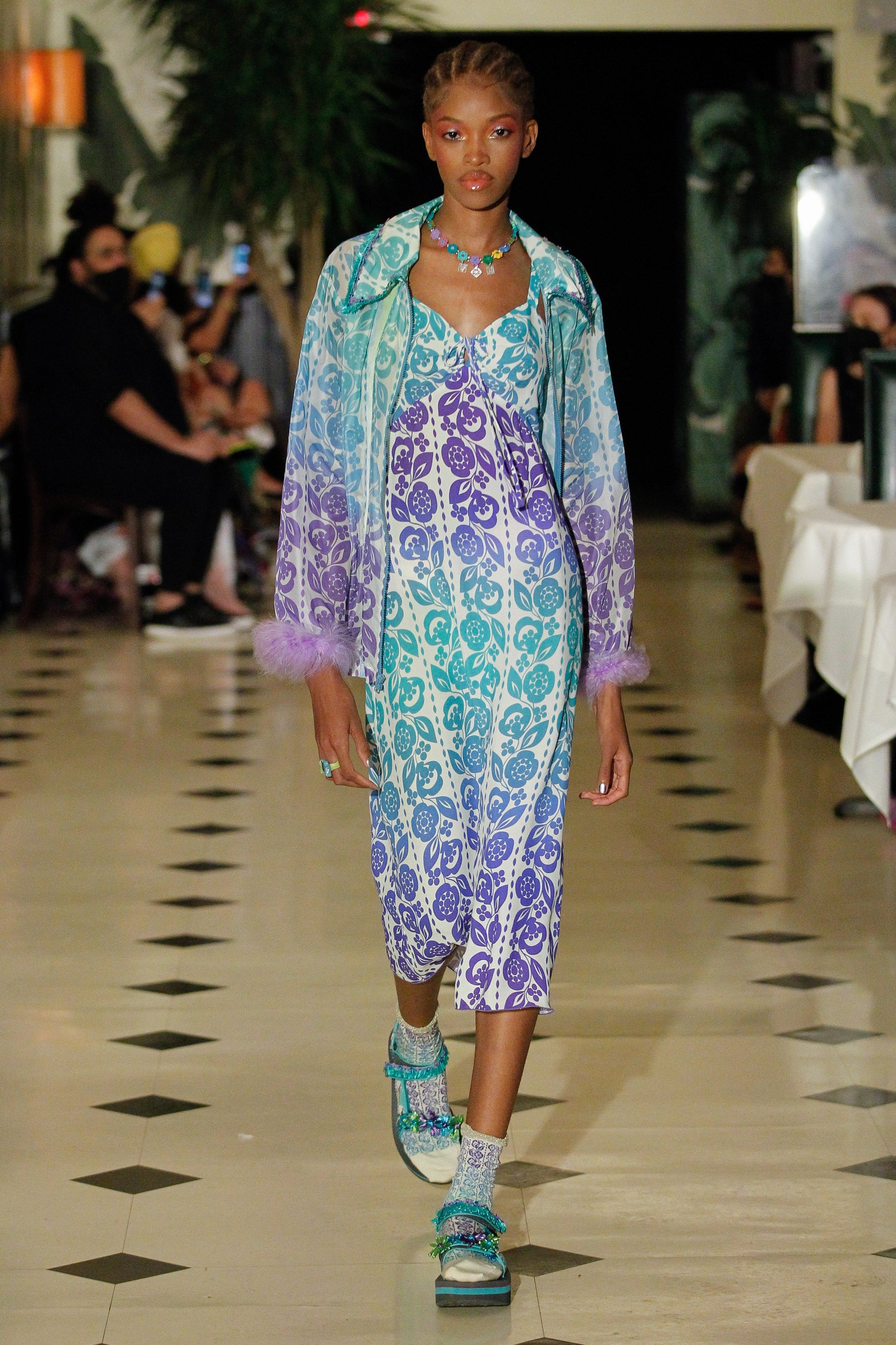 Dress under the runway lights, 2 shade of blue, bright light in middle and darker top and bottom