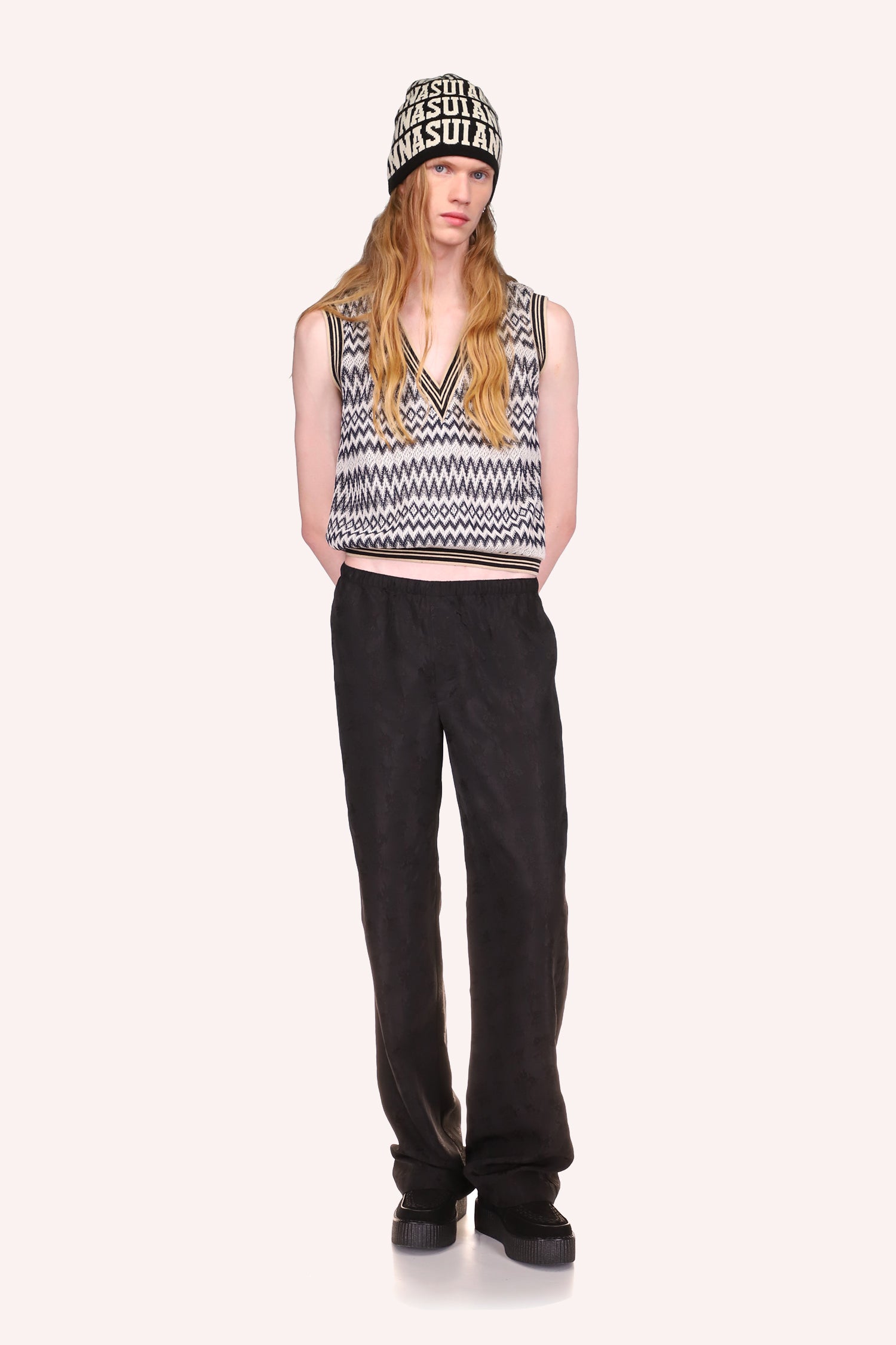 Floral Jacquard Pants is Black, long over the shoes, with a waist band paired with Zigzag Vest Black Multi