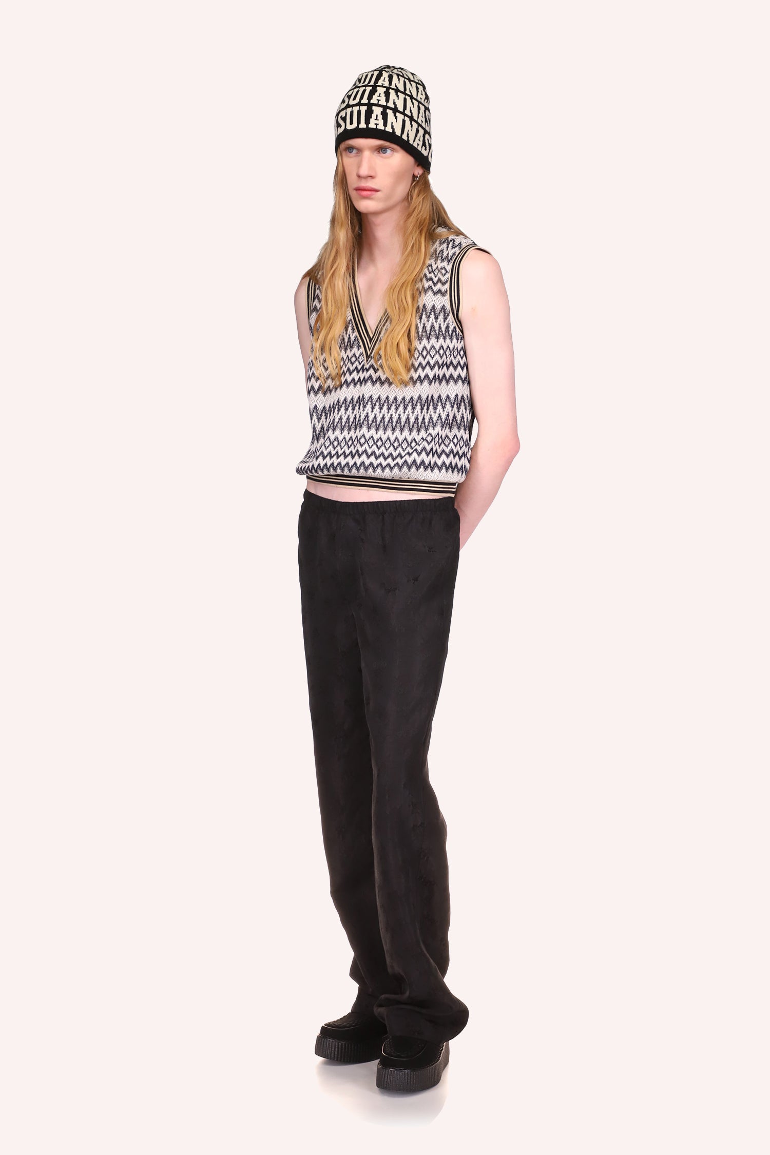 Black Jacquard Pants, long over the shoes, with a waist band paired with Zigzag Vest Black