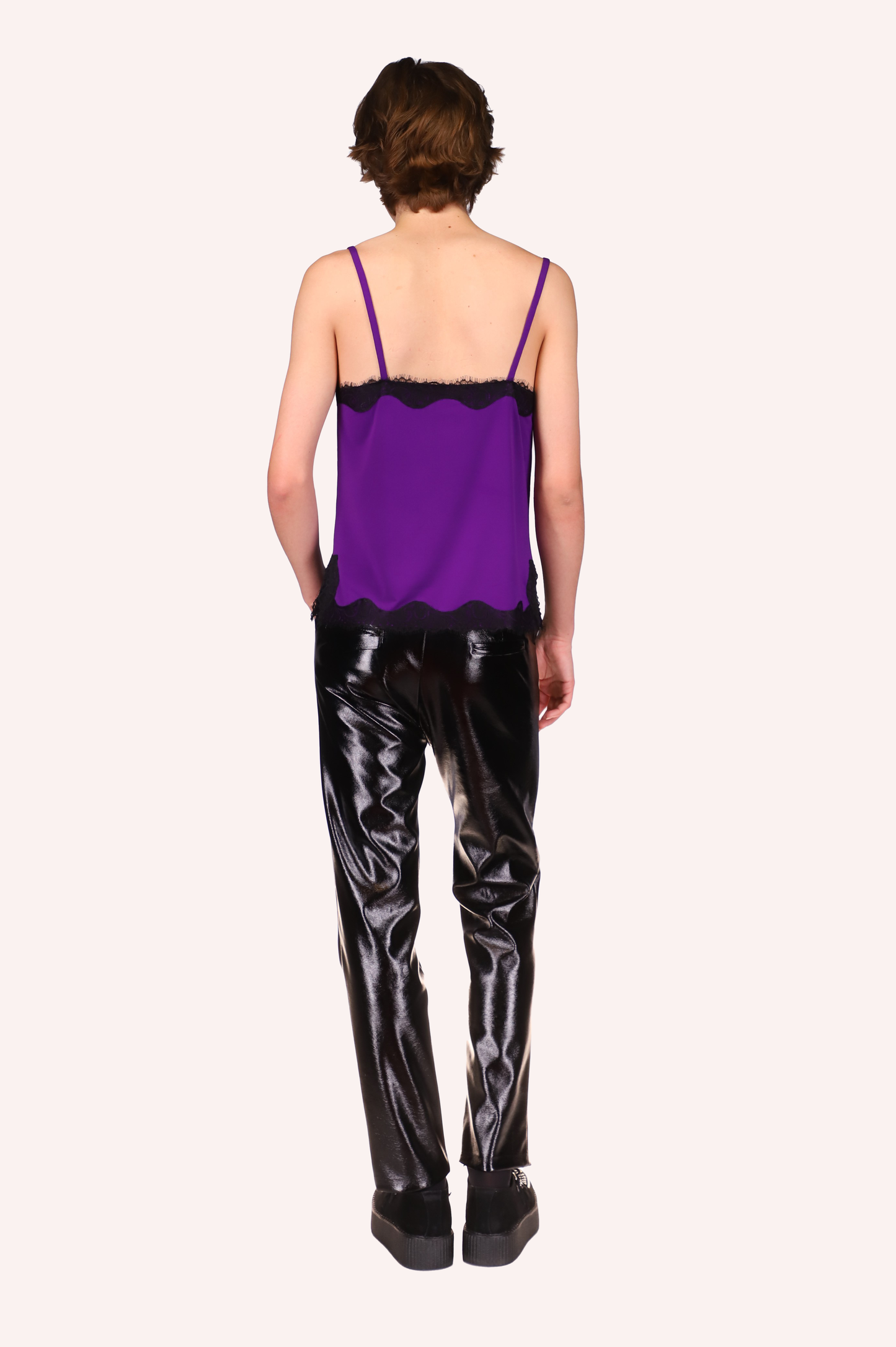 These genderless black patent pants can be worn with an Anna Sui camisole and shoes.