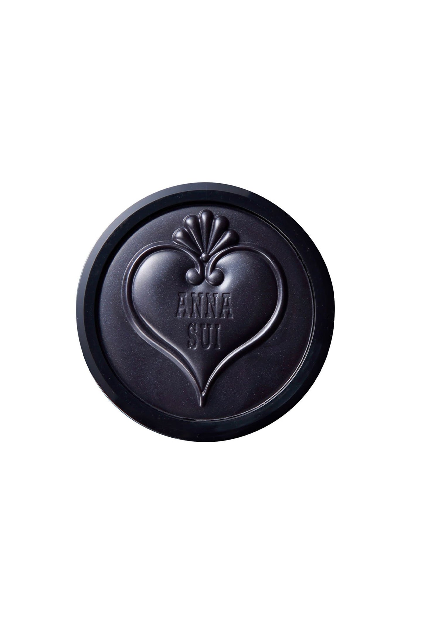 Black round heart-shaped, seashell on top, lid with Anna Sui label cover the top of cream blush