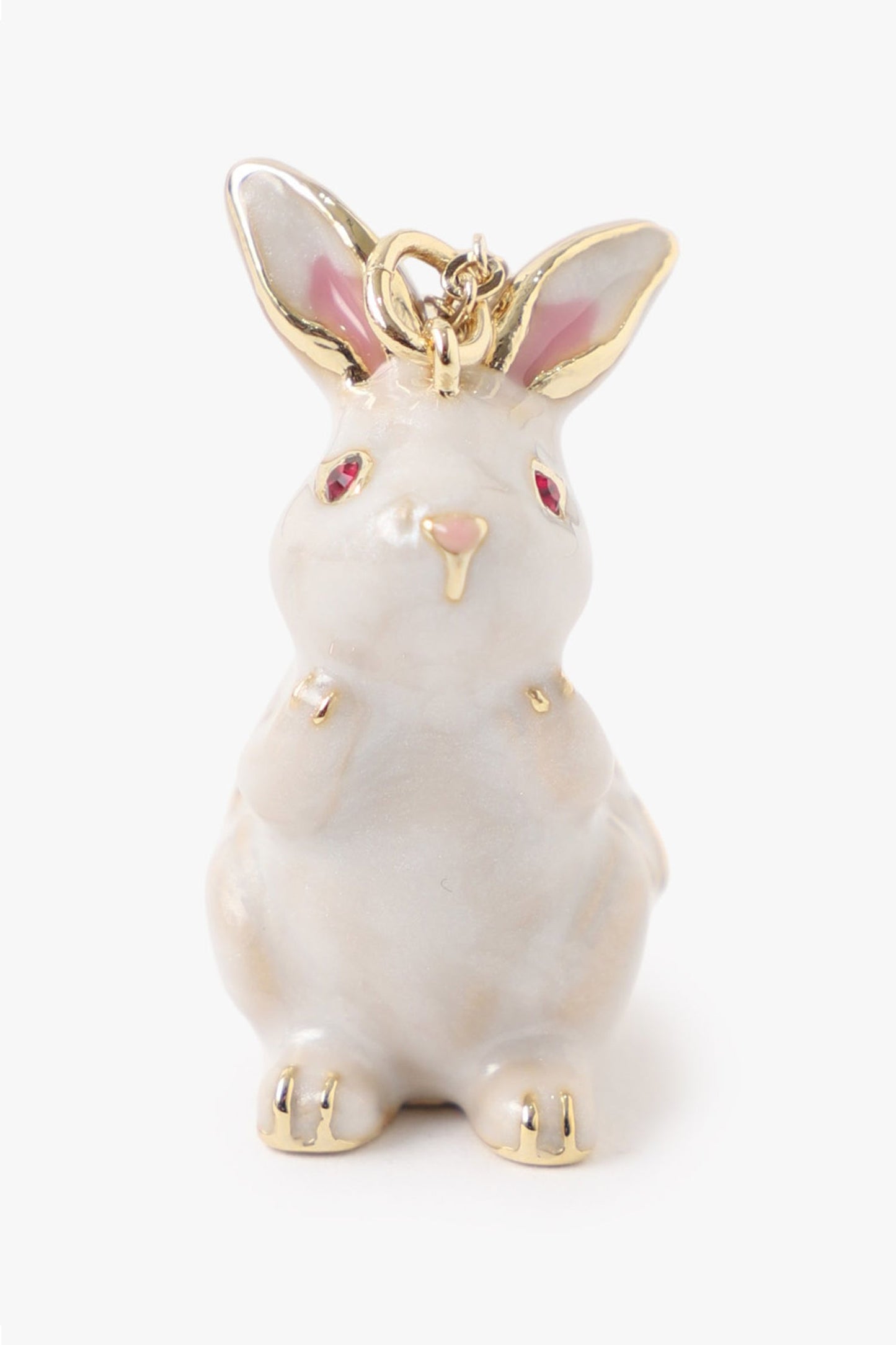 Rabbit in white, jeweled red eyes, golden details on ears, nose, head, golden kook on head