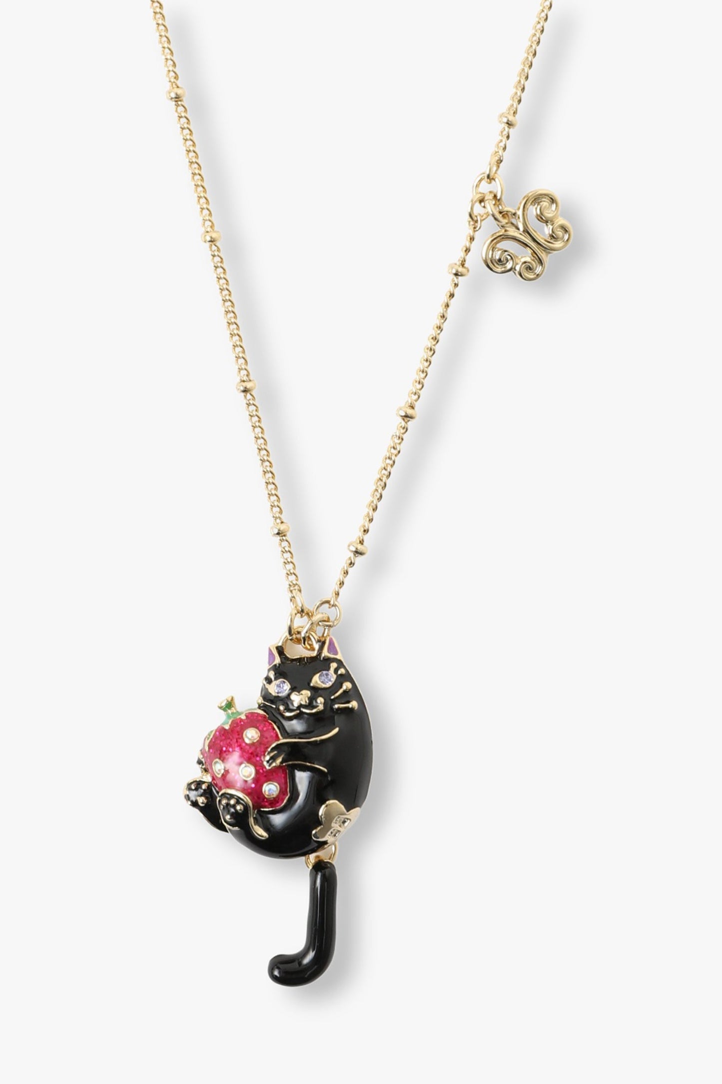 Yellow gold color plating edges on the black cat holding a strawberry, golden arabesque 
