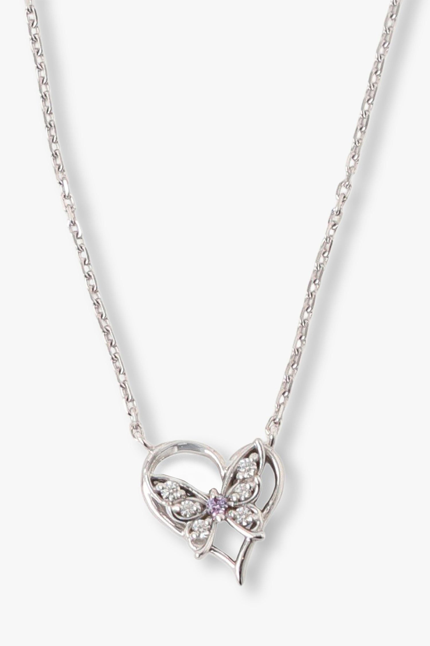 Pendant is a silver heart shaped with a butterfly with gemstones in the wings