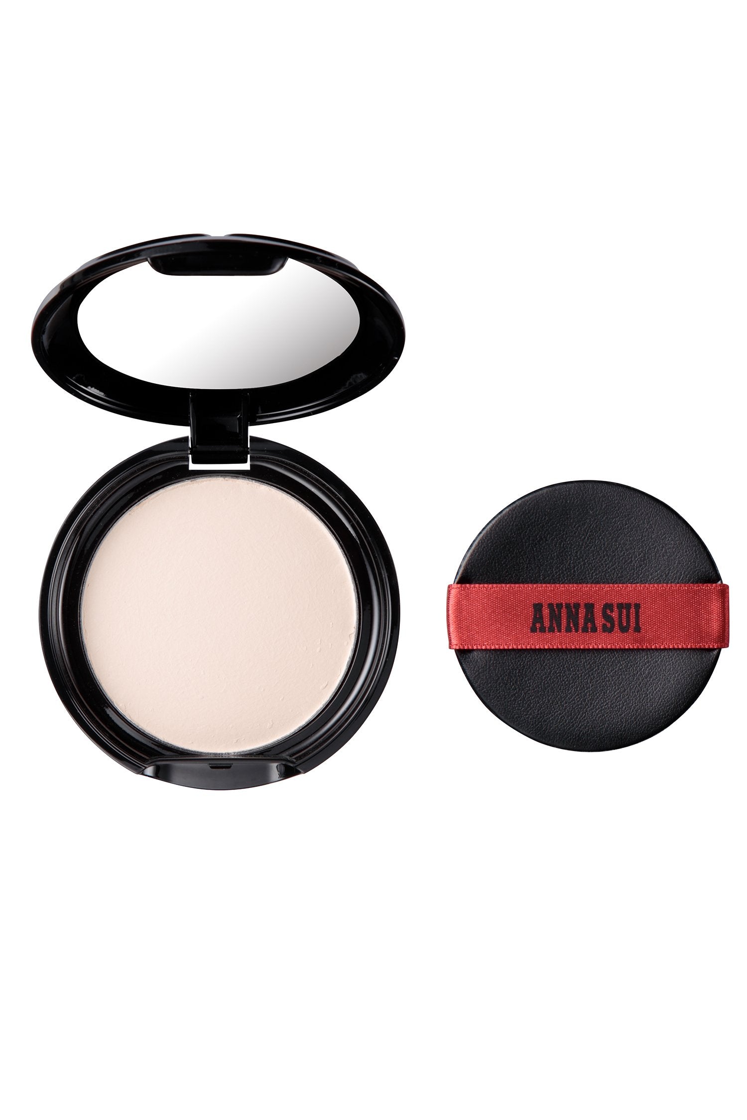 Stylish open powder case, rounded black, with powder mirror and a black pad with red ribbon with black Anna Sui label